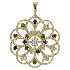 Ciondolo in oro 14k con gemme multicolore.
