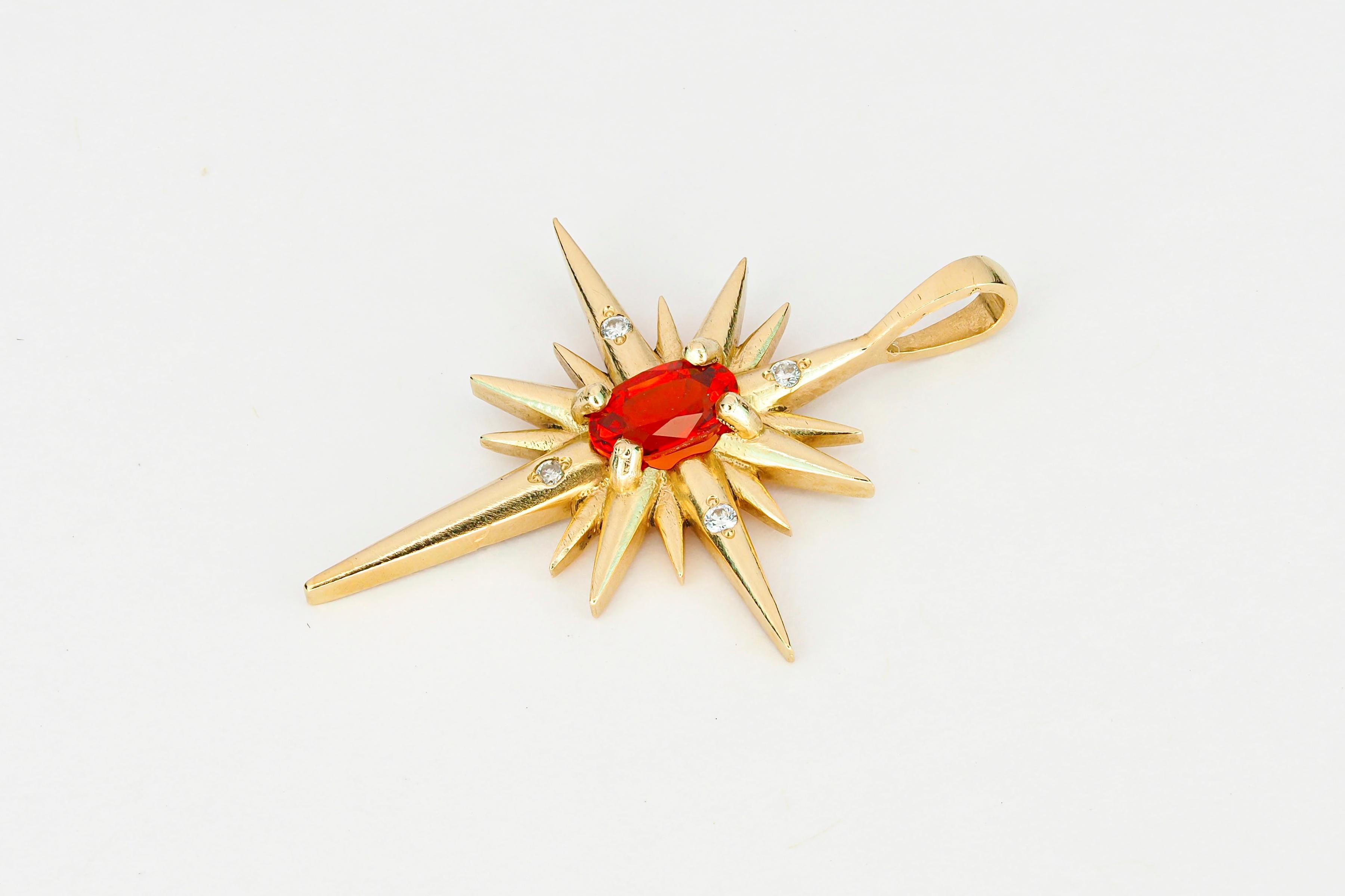 14 kt solid gold Star pendant with orange-red natural sapphire and diamonds. September birthstone.

Metal: 14k gold
Size: 25.5 x 18.5 mm.
Total weight: 1.60 g.

Gemstones:
Natural sapphires: oval shape, orange red color, transparent with inclusions,