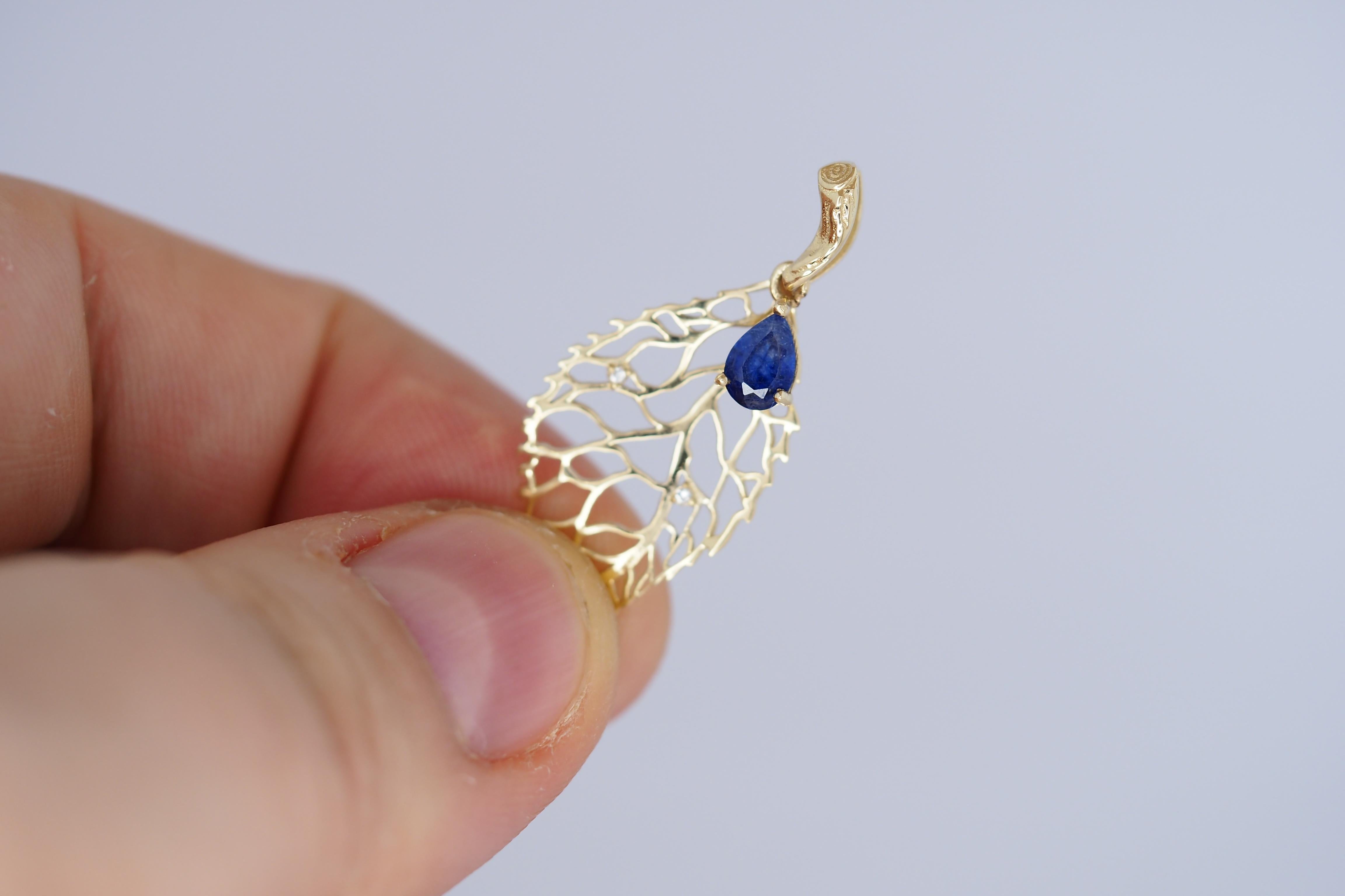 14k gold leaf pendant with sapphire and diamonds. Floral gold pendant.

Weight: 1.2 g.
Gold - 14k gold
Pendant size: 37 х 14.86 mm.
Central stone: Natural sapphire
Cut: Pear
Weight: approx 0.7 ct.
Color: Blue (can be little lighter or