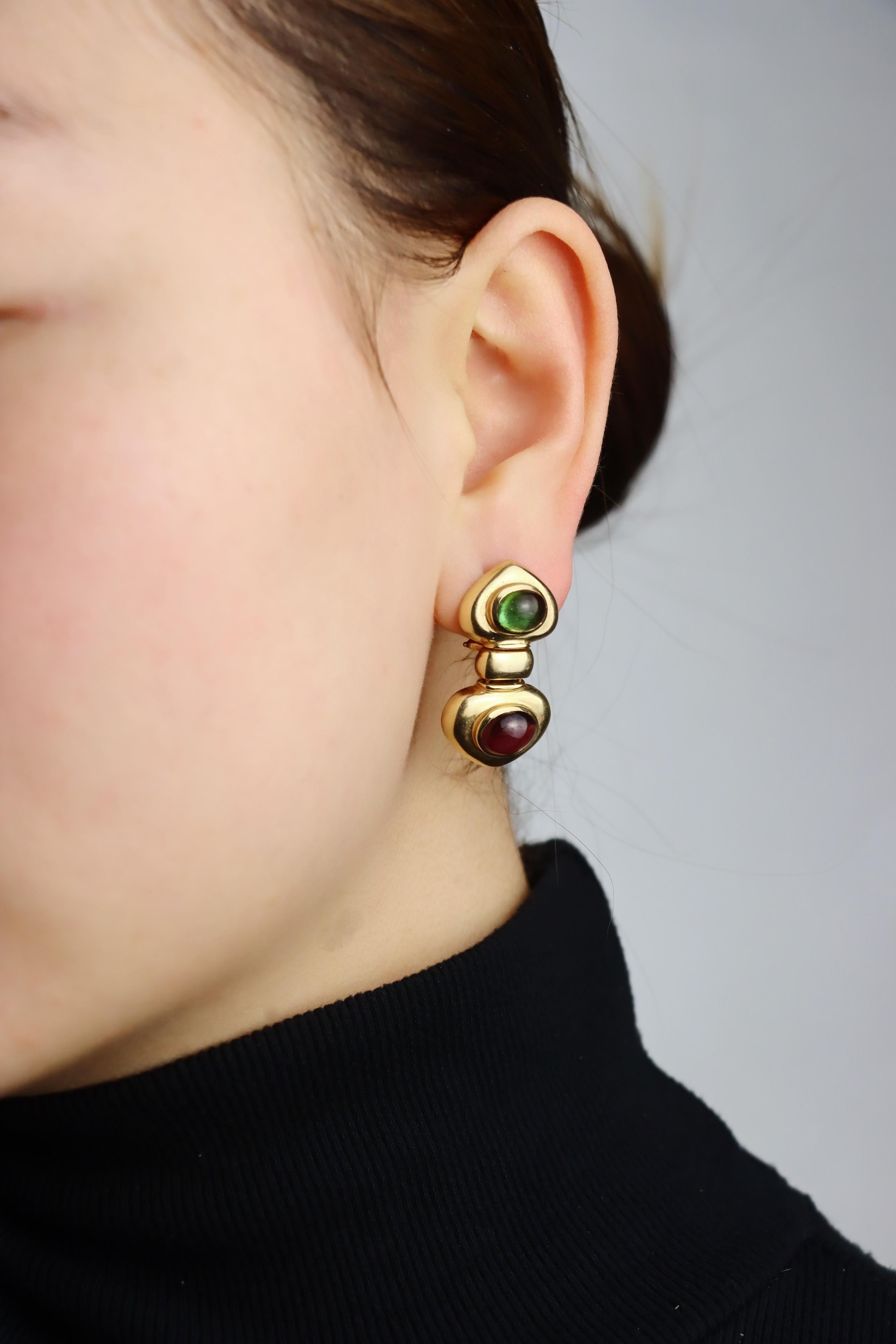 Orecchino in oro 14K con tormalina rosa e verde

Contrassegnato:
14K

Dimensioni approssimative:
3,2 cm (lunghezza) 
1,8 cm (larghezza) 
17,9 grammi di peso.