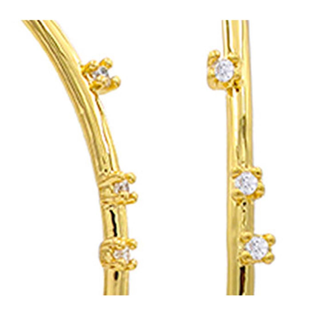 High polished 2.55 inch 14k gold plated brass thread hoop with scattered prong set white Cubic Zirconia stones. The understated glamour of these thread earrings with CZ is that they are randomly placed for an effortless look too compliment any