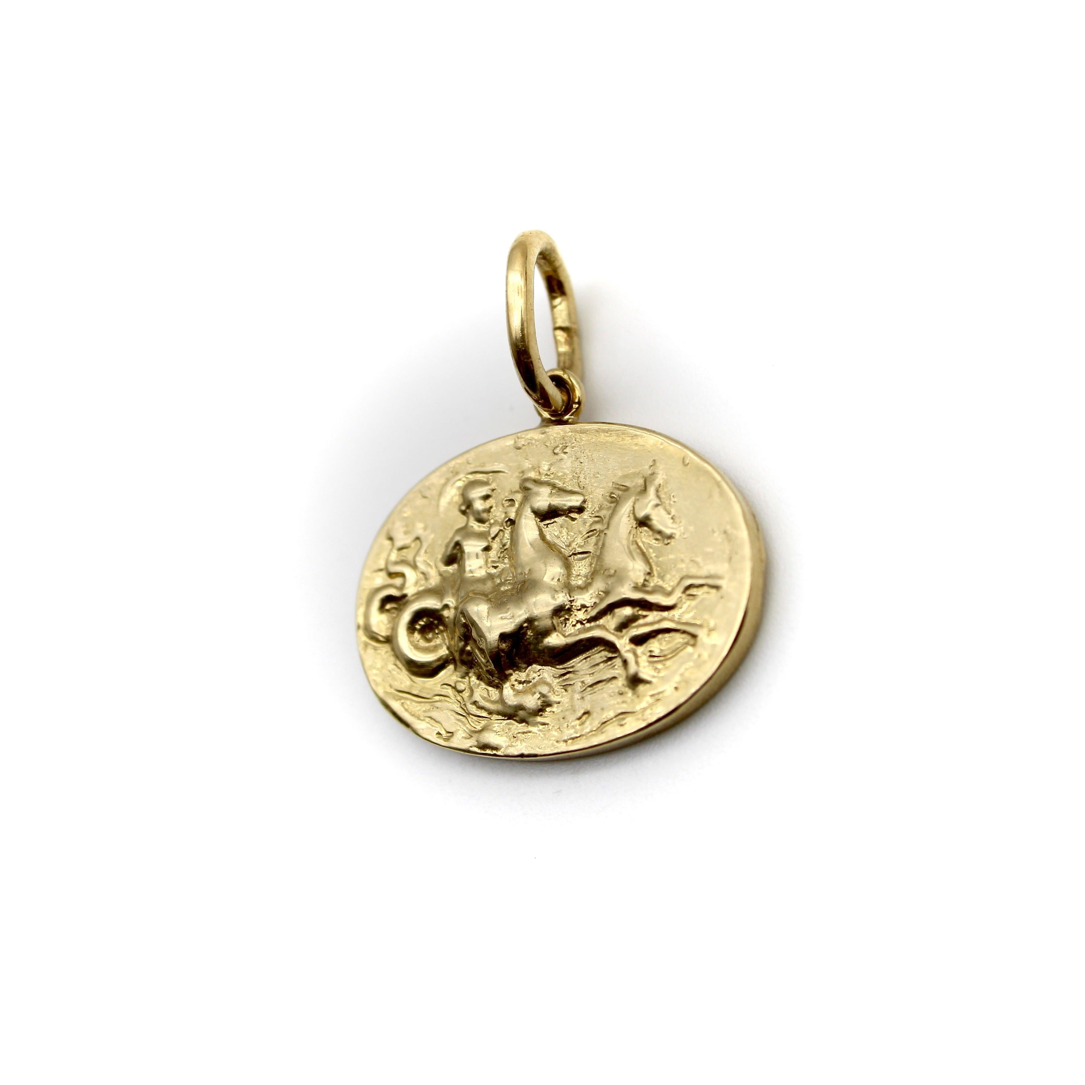 Created as part of our signature collection, this 14k gold intaglio medallion depicts Poseidon, god of the sea, riding two hippocampi across turbulent ocean waves. The oval medallion hangs horizontally from an oversized bail, and the texture of the