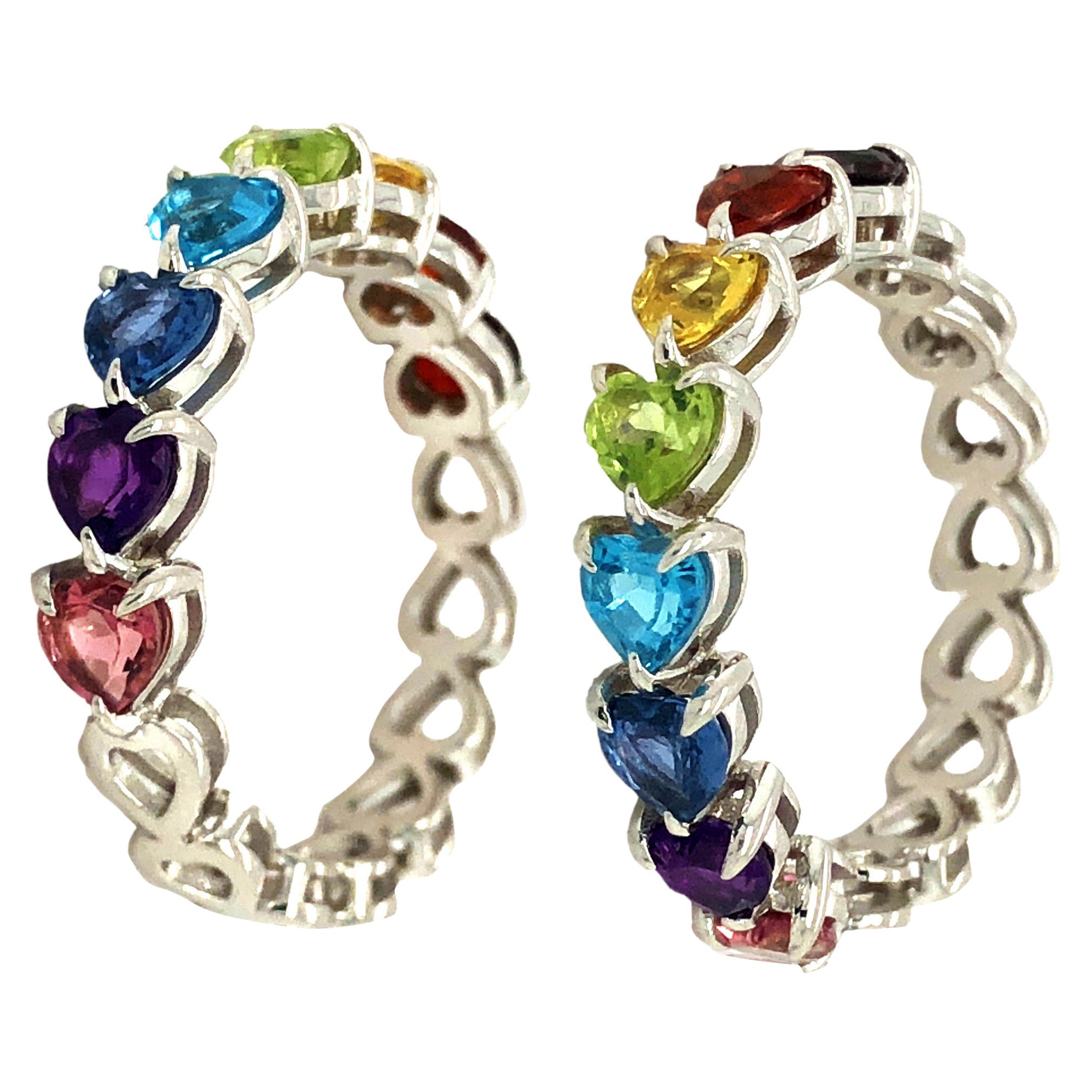 Anillo de media eternidad arco iris de oro blanco de 14k
