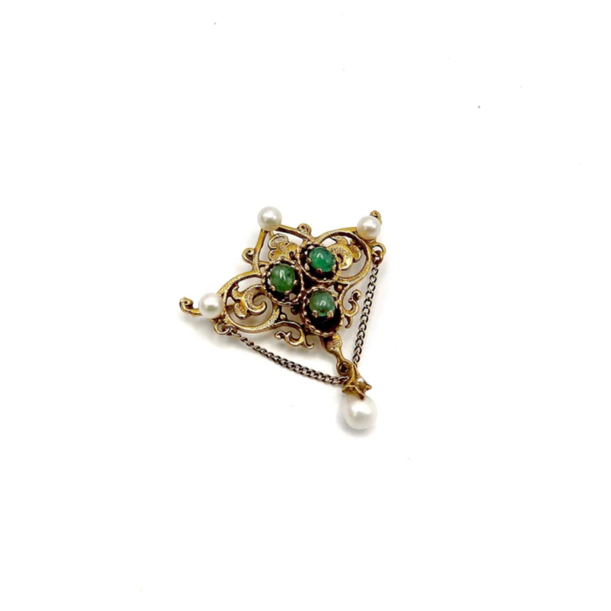 A lovely piece of jewelry from the early 1940’s can be worn as a pendant or brooch. A Renaissance Revival piece, notable for its swooping golden line, organic forms and decorations that looked to nature for inspiration. It is 14K gold, and features