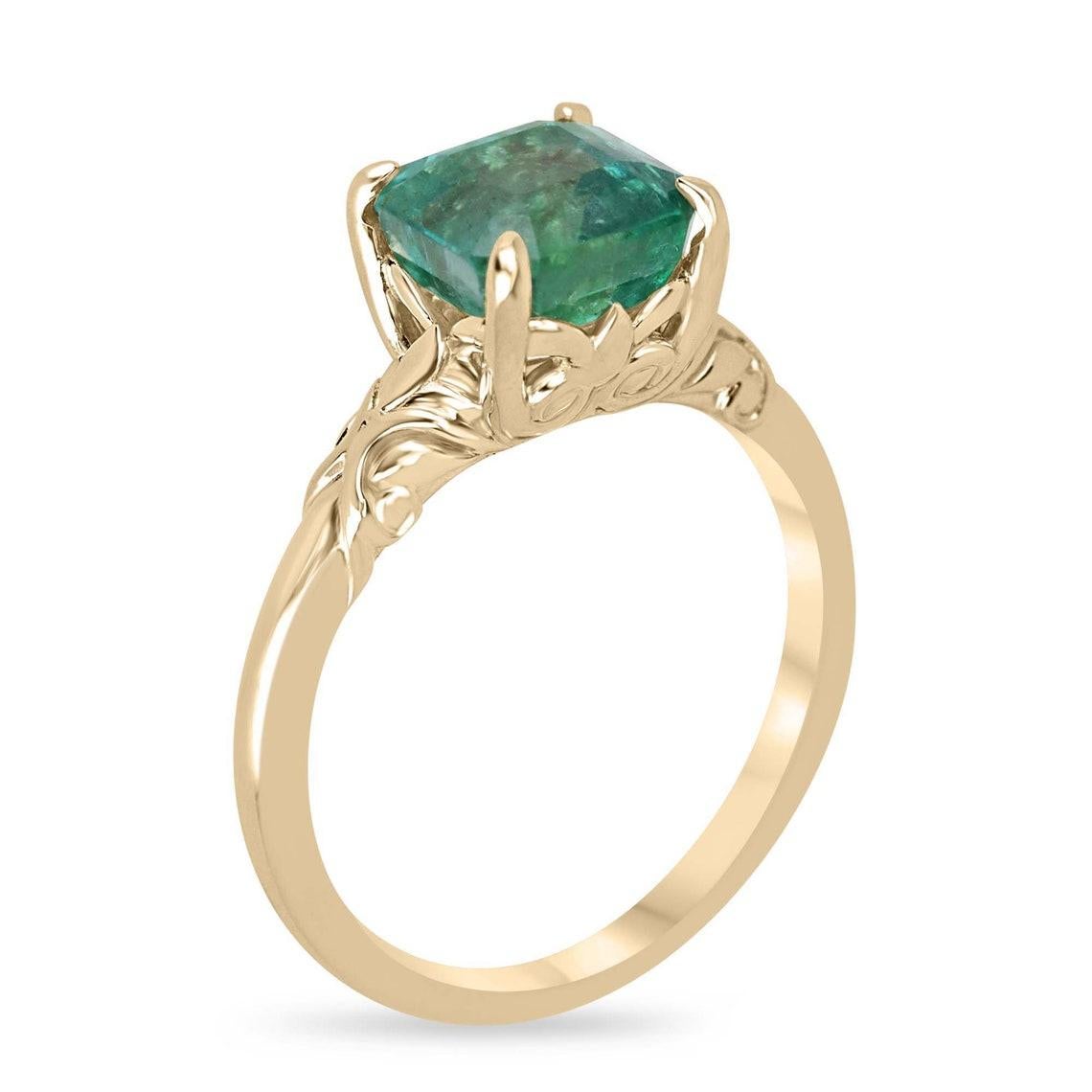 Elevate your style with our enchanting solitaire emerald ring, showcasing a mesmerizing 2.37-carat asscher cut emerald at its heart, radiating a medium green hue with transparent clarity. Set in a refined four-prong setting, the emerald takes center