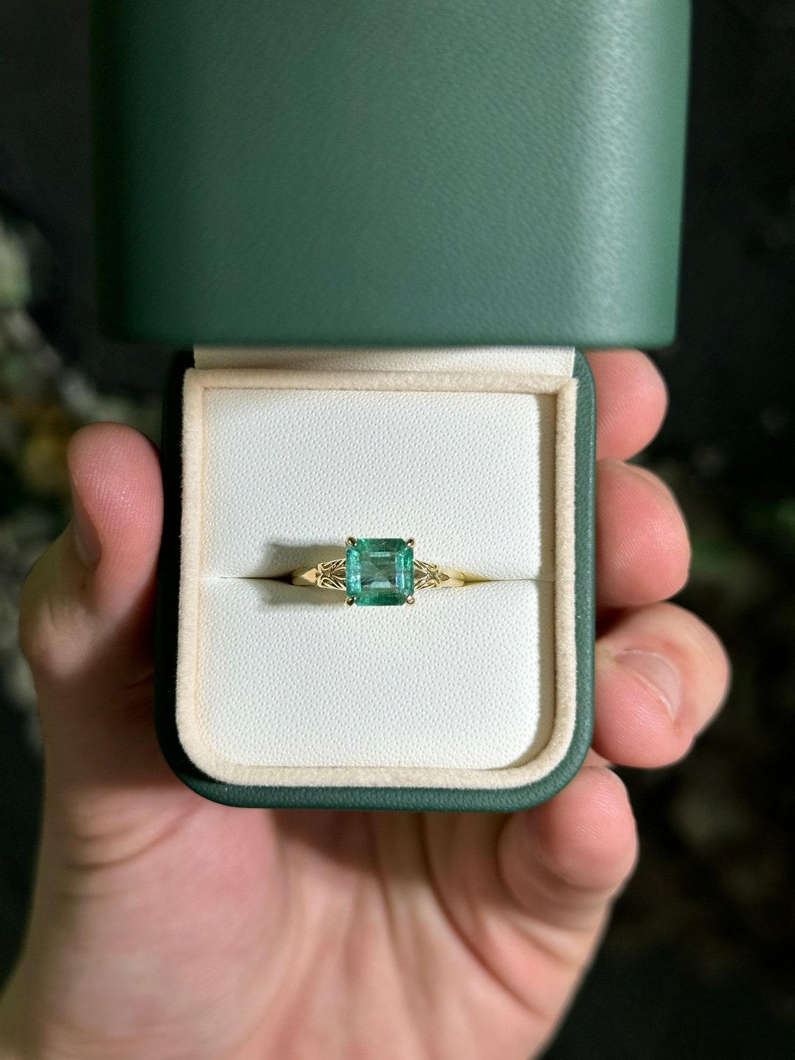 Women's 14K gold ring featuring a 2.37ct natural Asscher cut emerald in a regal floral For Sale