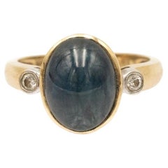 14k gold ring with a cabochon-cut sapphire 6.00ct and diamonds