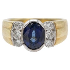14k Gold ring with an oval natural sapphire and diamonds