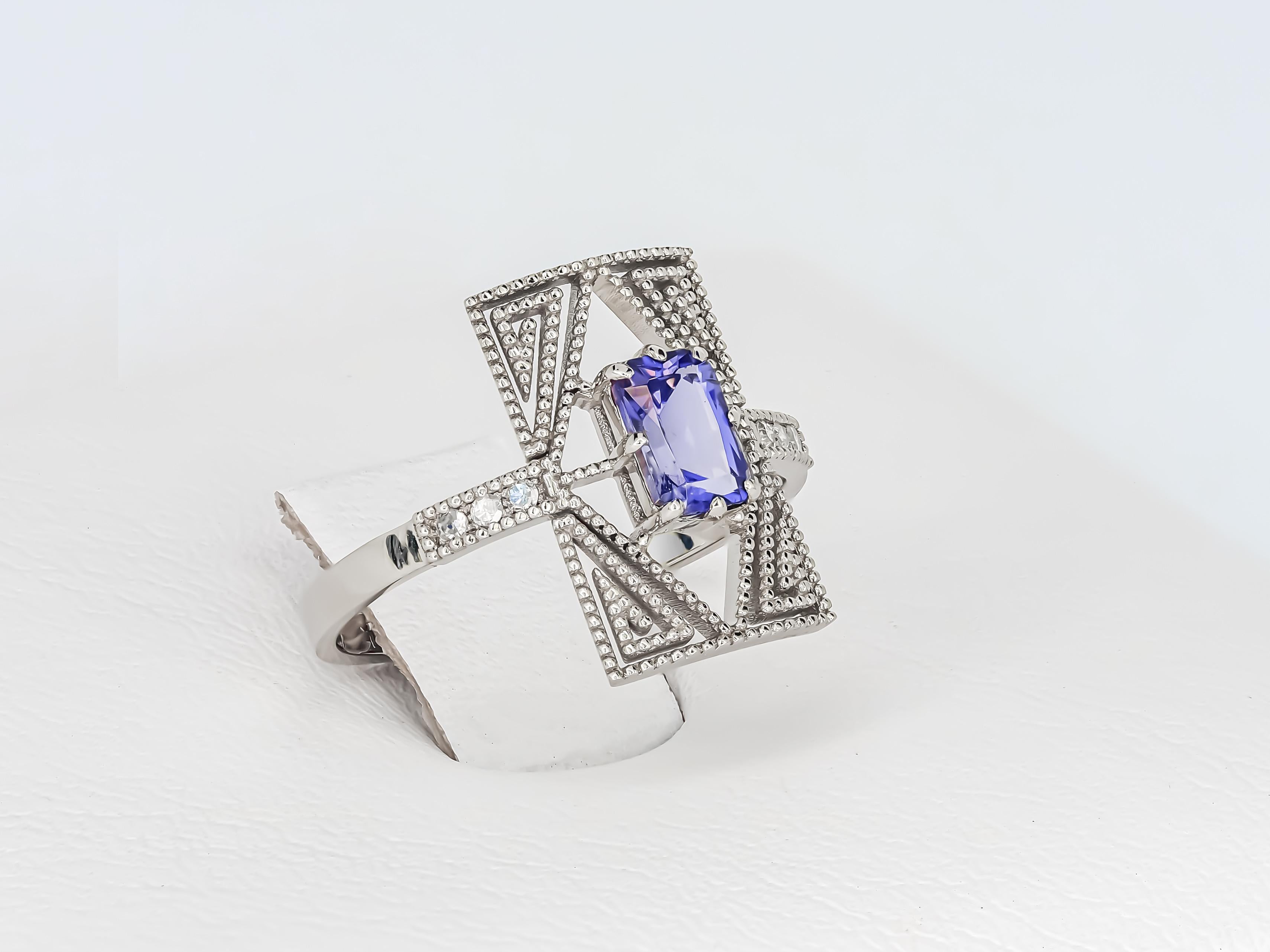 Ring with spinel and diamonds.
14 kt white gold
Weight: 2.08 g.
Size:17.2 mm. (US - 7, UK - O, FR - 54)

Central stone: Spinel
Weight : approx 0.80 ct in total (6 x 4 mm)
Emerald cut, color - blue
Clarity: Transparent with inclusions
Diamonds: