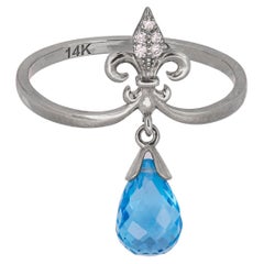 Anillo de oro de 14k con topacio talla briolette y diamantes