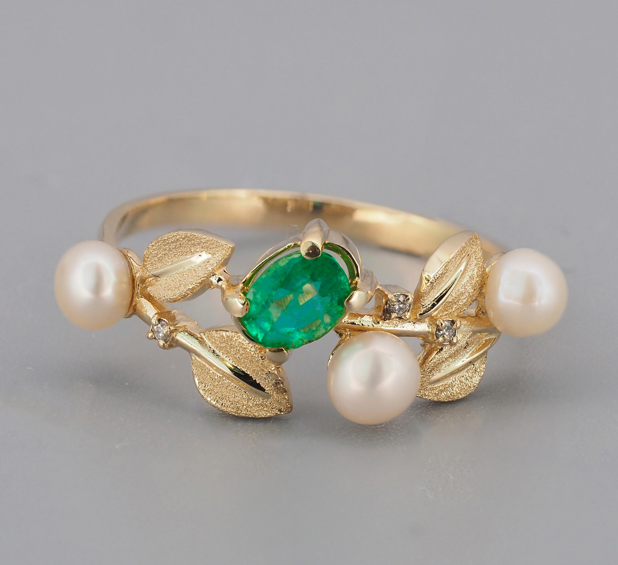 14k gold ring with emerald, pearls and diamonds. 
Weight approx. 2.2 g.
Gold - 14k yellow gold

Central stone: Emerald
Cut: Oval
Weight: aprx 0.7 ct. (6x4 mm)
Color: blue - green
Clarity: Transparent with inclusions (See in photo)
Diamonds: G/VS1,