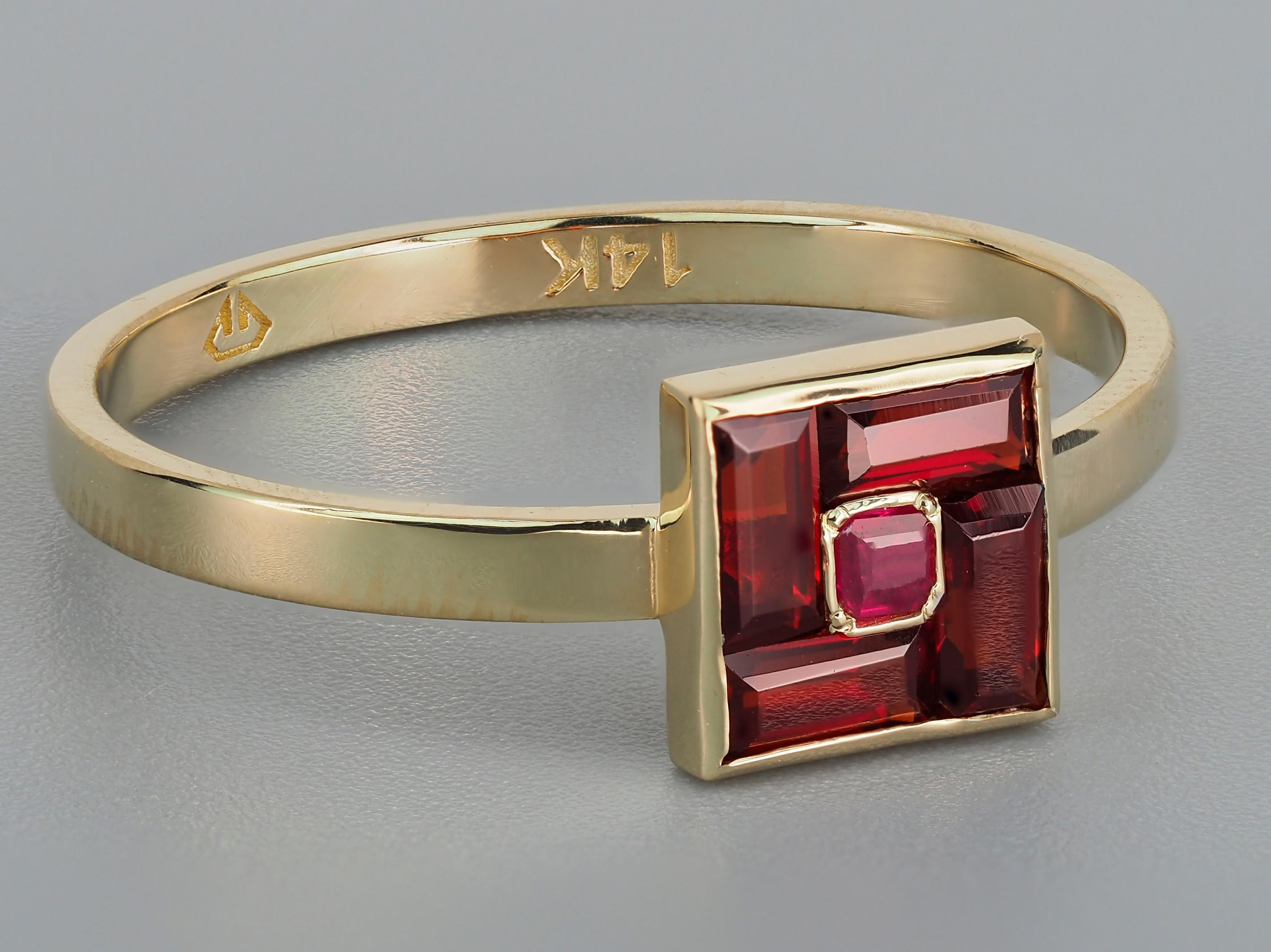 14k Gold ring with garnets and ruby.

Weight: 1.4 g. depends from size
Metal: 14k marked

Set with garnets:
Baguette shape, red color, aprx 0.6 ct total (4x015. ct)
Clarity: SI

Ruby: princess cut, G/VS, 0.10 ct., red color - 1 piece

auction