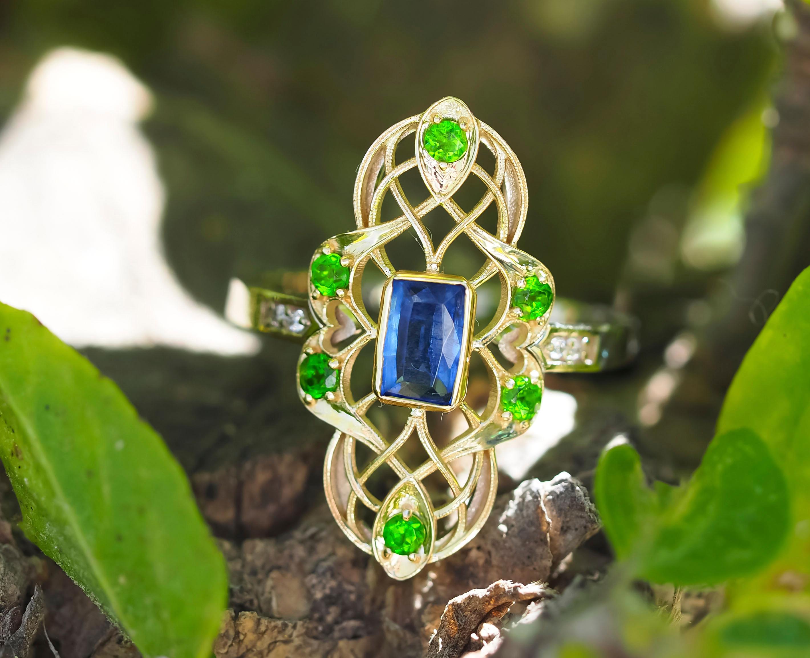 14k gold ring with kyanite, chrome diapsides, diamonds

14 k gold

total weight 2.75 gr

Gemstones (all are tested by proffesional gemmologist)

Kyanite
Octagon cut, 0.8 ct, transparent, royal blue green color. 

Diamonds
Round brilliant cut, G/VS,