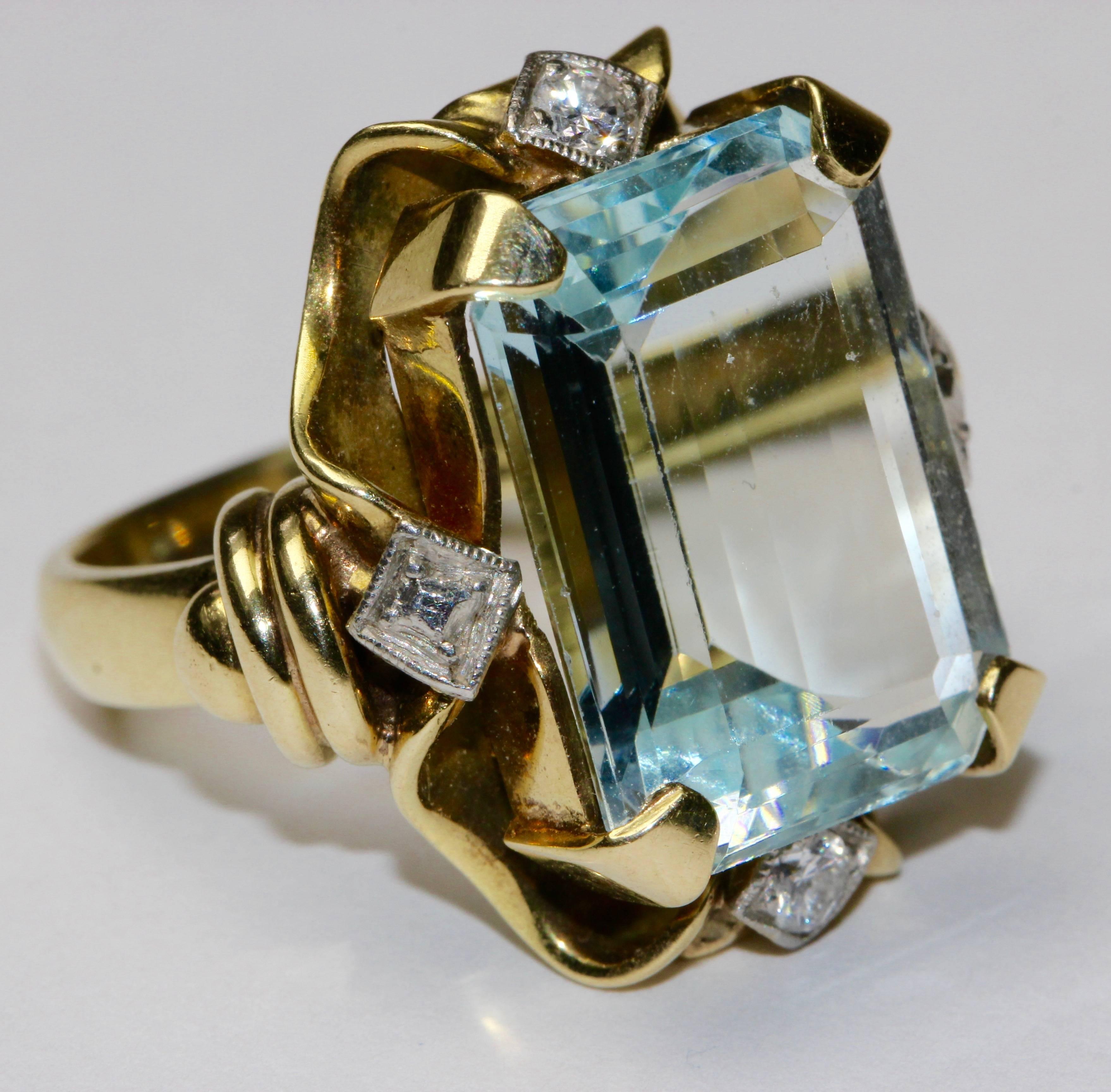 Women's 14K gold ring with large aquamarine and two brilliants