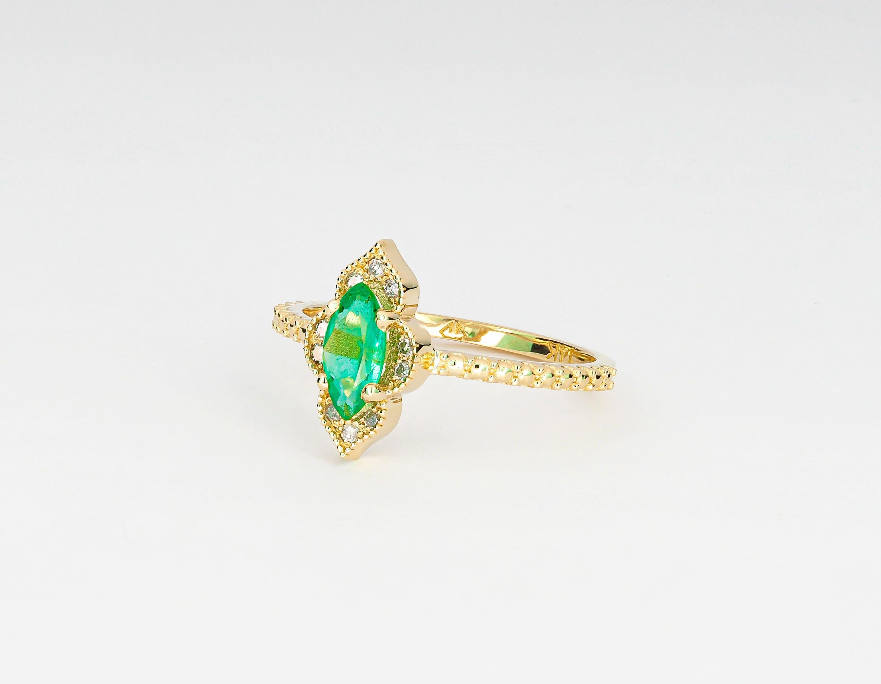 Im Angebot: 14 Karat Gold Ring mit Smaragd im Marquise-Schliff und Diamanten () 7