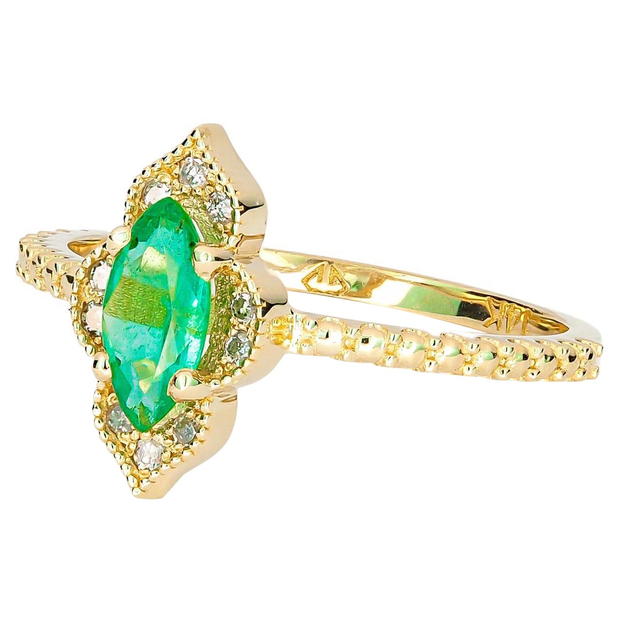 Anello in oro 14k con smeraldo marquise e diamanti