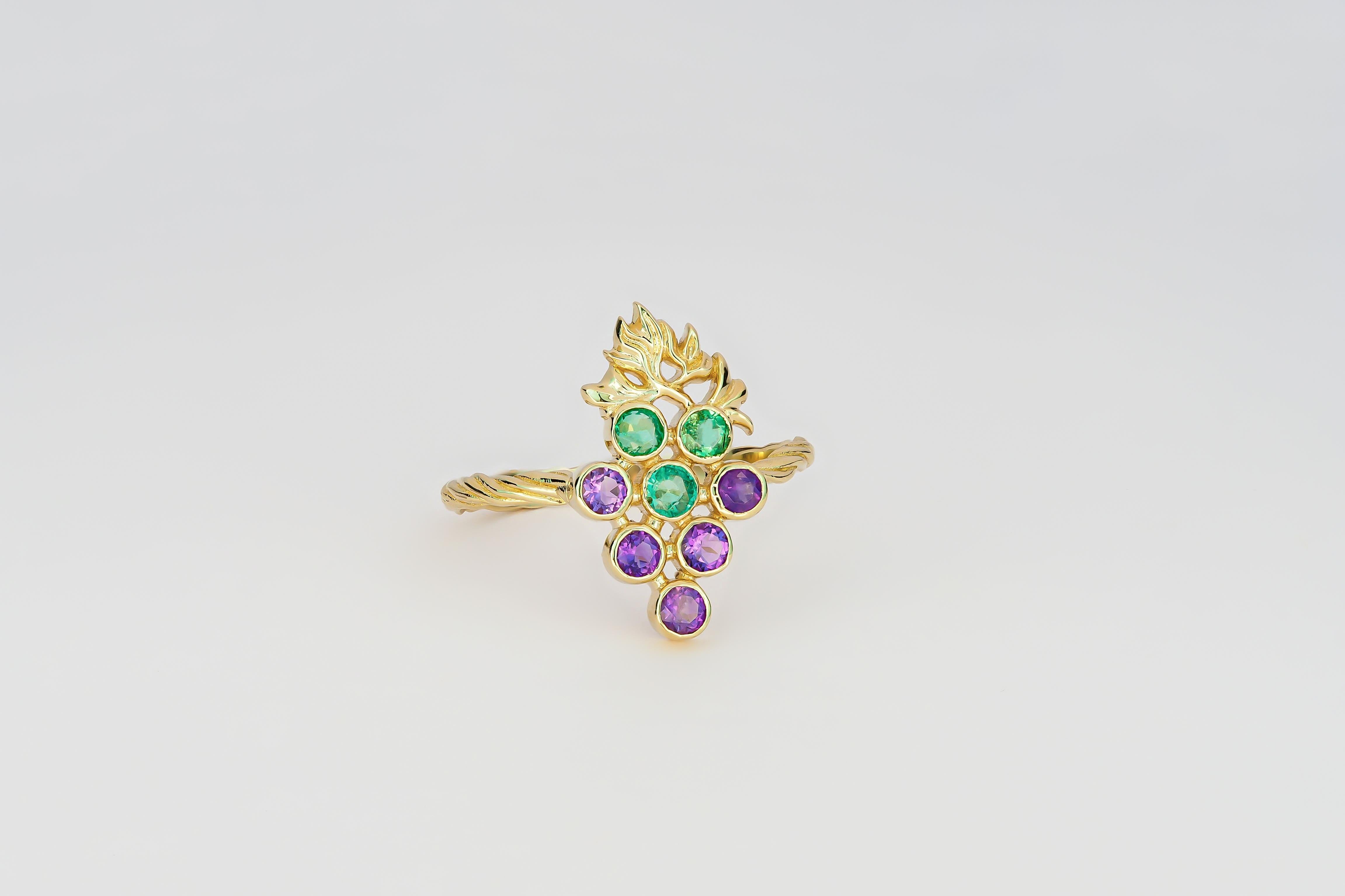 14k gold ring with natural emeralds and amethysts. 
May birthstone. February birthstone.
Metal: 14kt solid gold
Weight approx. 1.95 g.

Gemstones:
Natural emeralds: 3 pieces, weight - 0.33 ct approx (3 pieces x 0.11 ct)
Color - green, round cut,