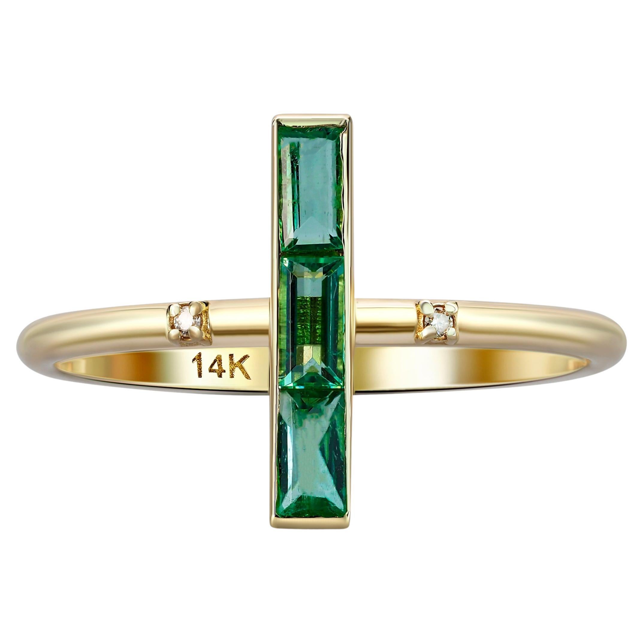 14k gold ring with natural Emeralds. 