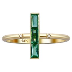 14k gold ring with natural Emeralds. 