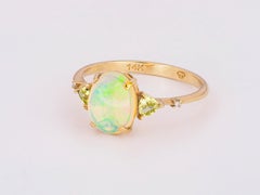 Anello in oro 14k con opale, diamanti e peridoti
