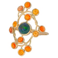 Ring aus 14 Karat Gold mit Opal und Saphiren. 