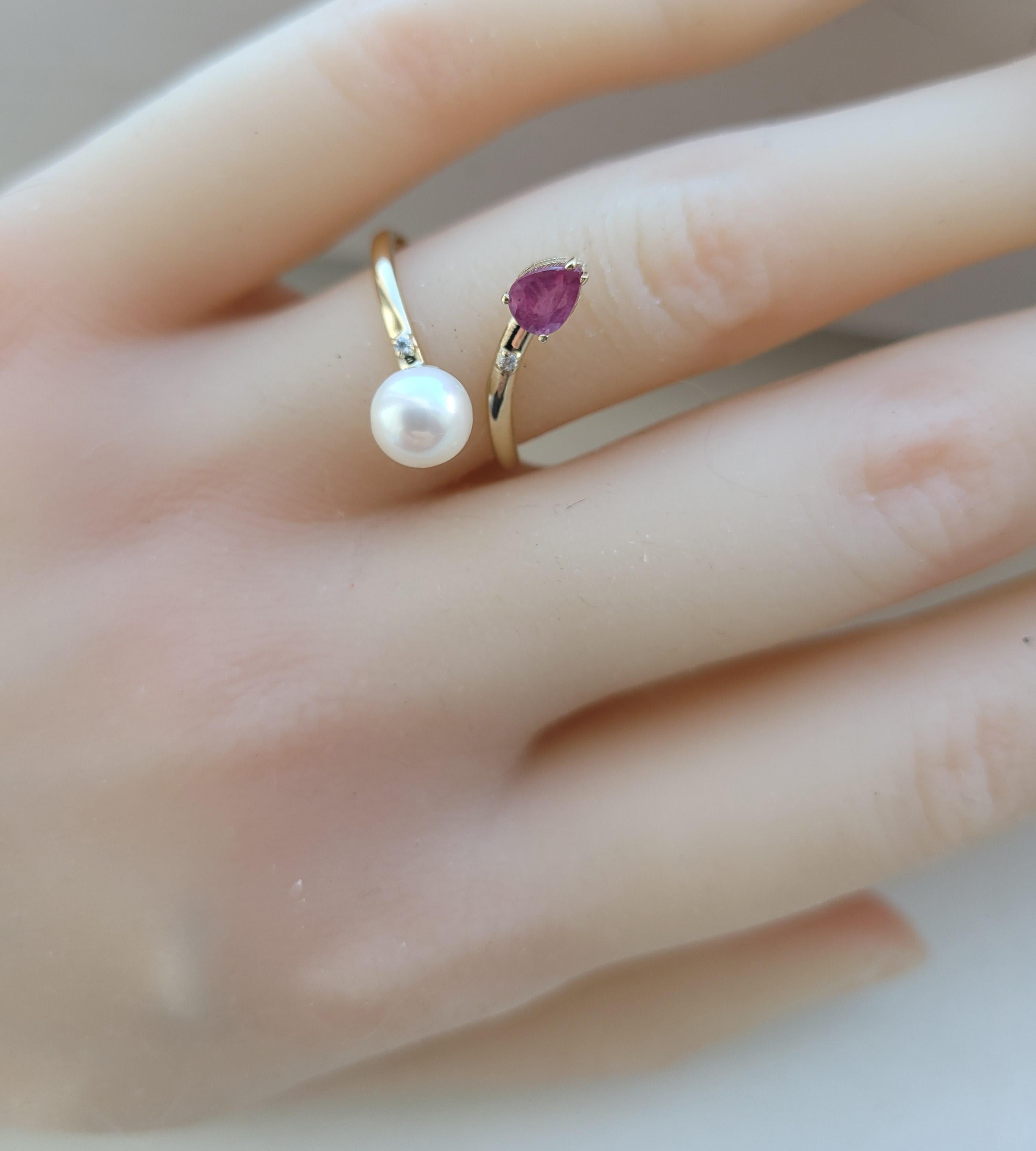 in vendita:  Anello in oro 14k con perle, rubini e diamanti 5