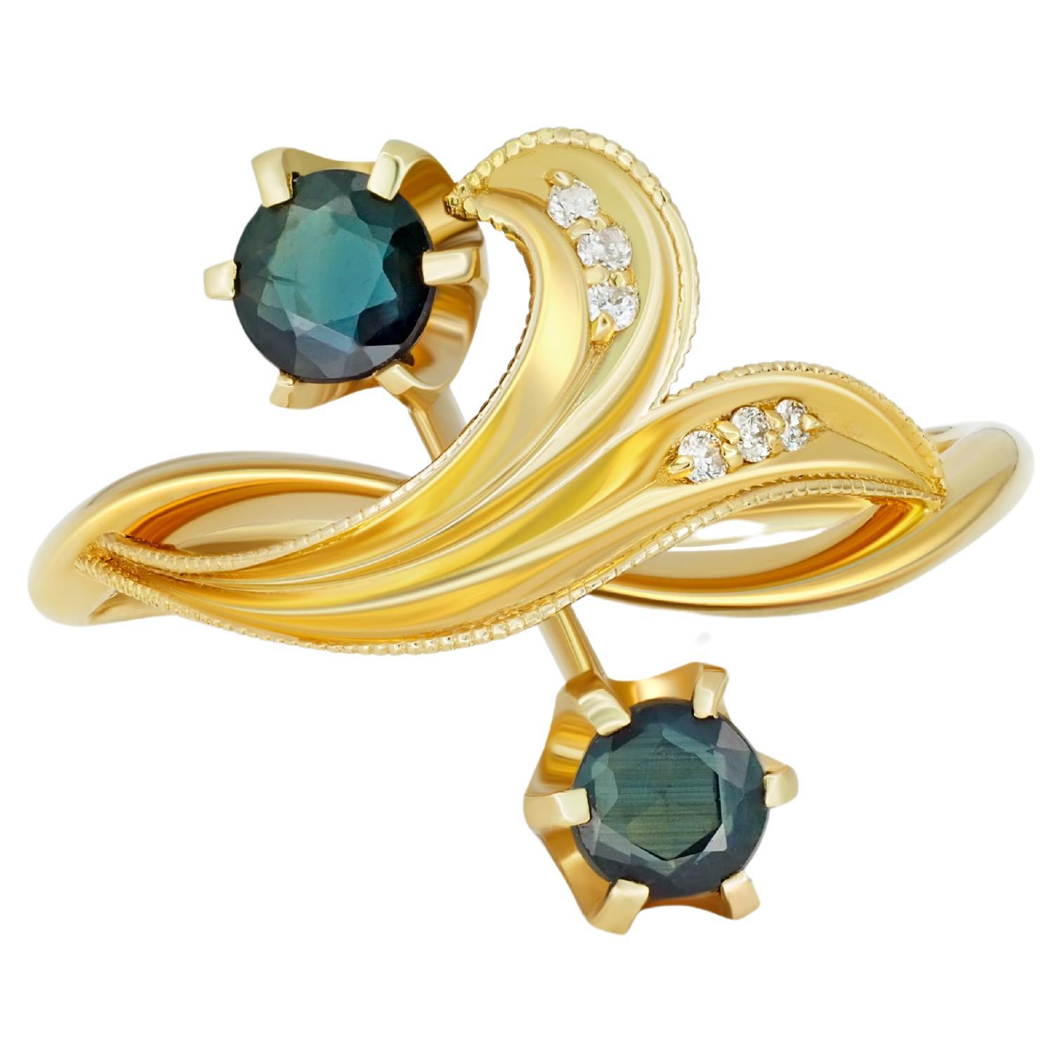14k gold ring with Round Sapphires. 
