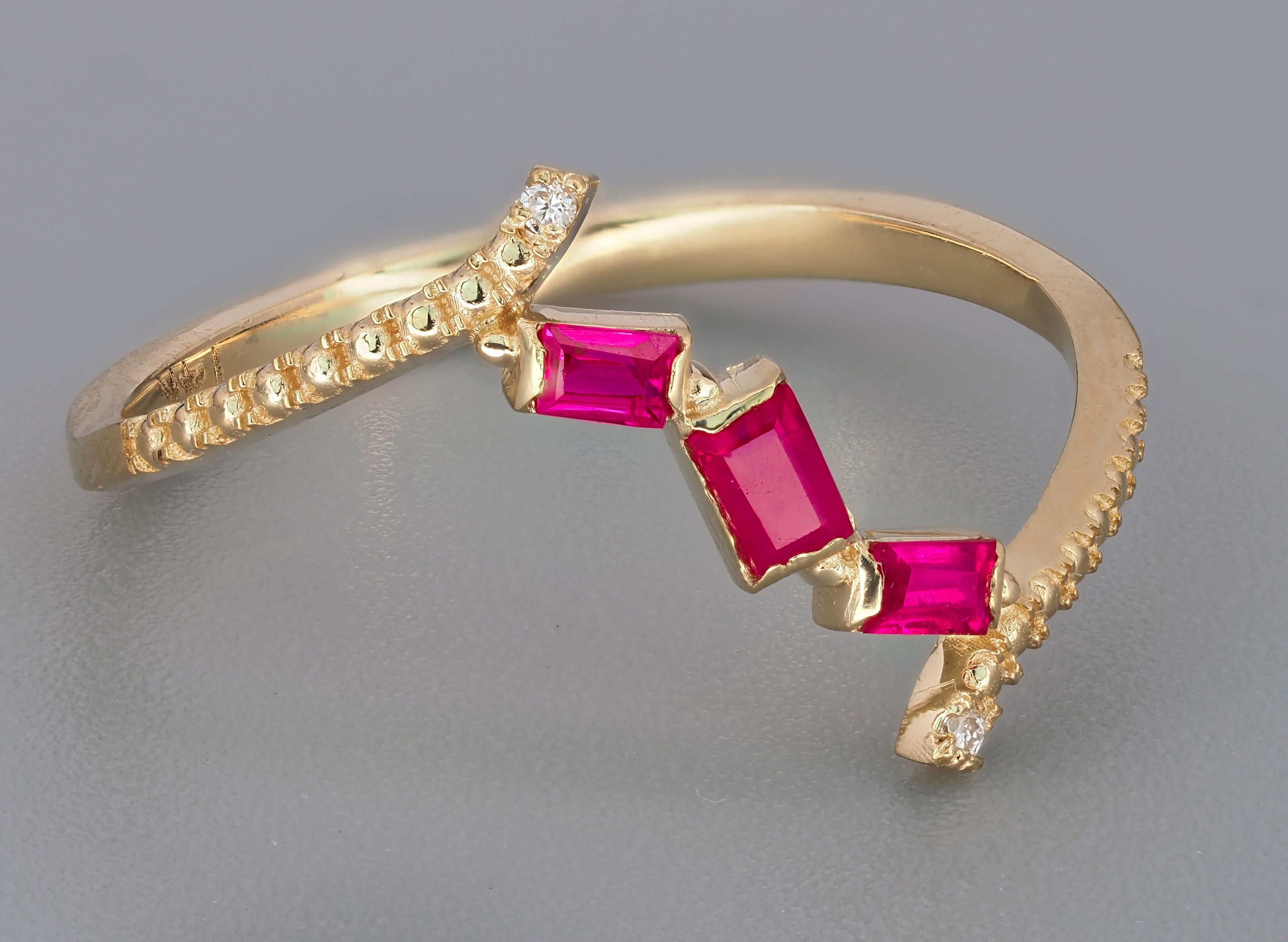 14 kt solid gold ring with natural rubies and diamonds. July birthstone.
Weight: 1.3 g. - depends from size

Central stone: Natural rubies - 3 pieces
Cut: Baguette
Weight: approx 0.60 ct.
Color: Red
Clarity: Transparent with inclusions (See in