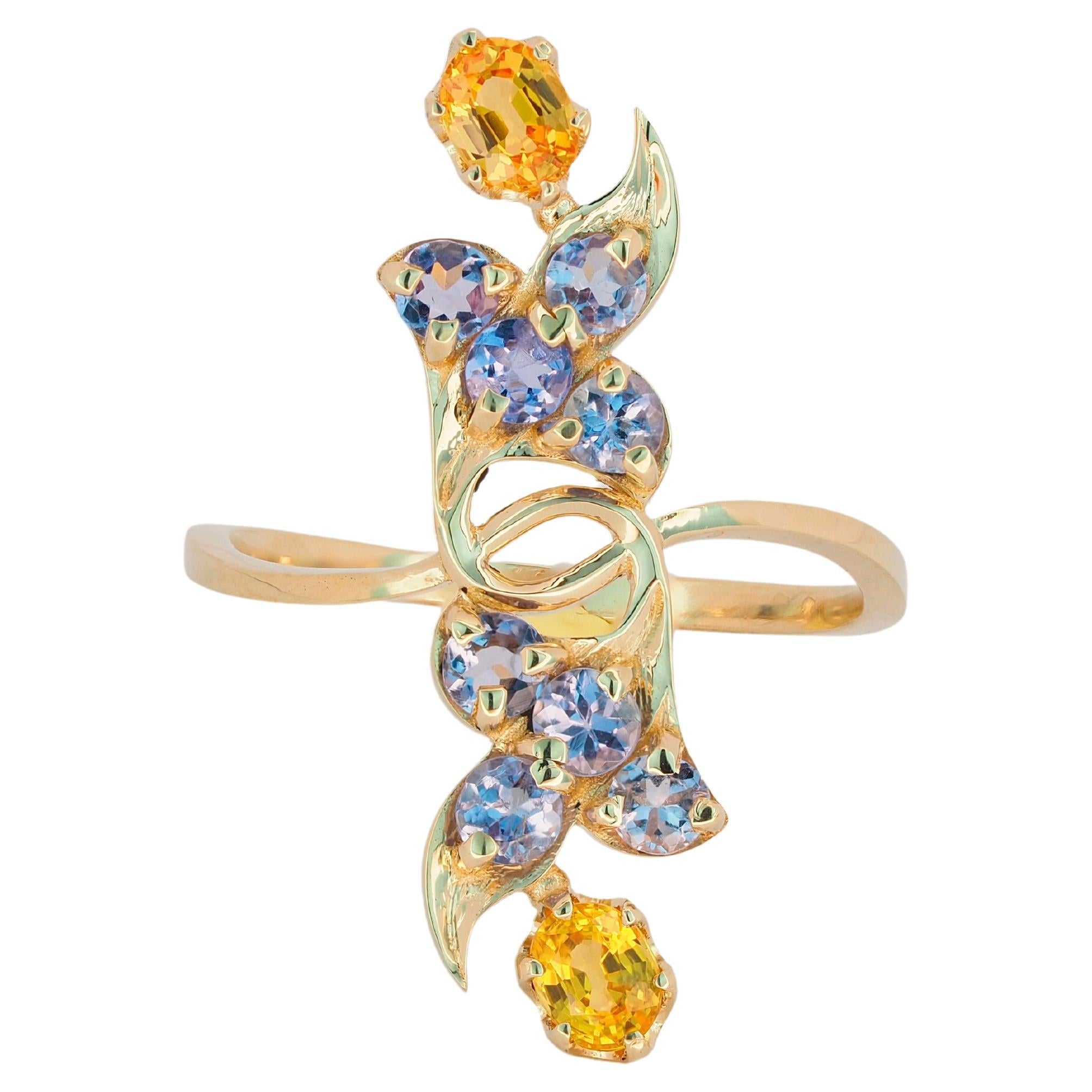 14 karat gold ring with genuine sapphires and tanzanites