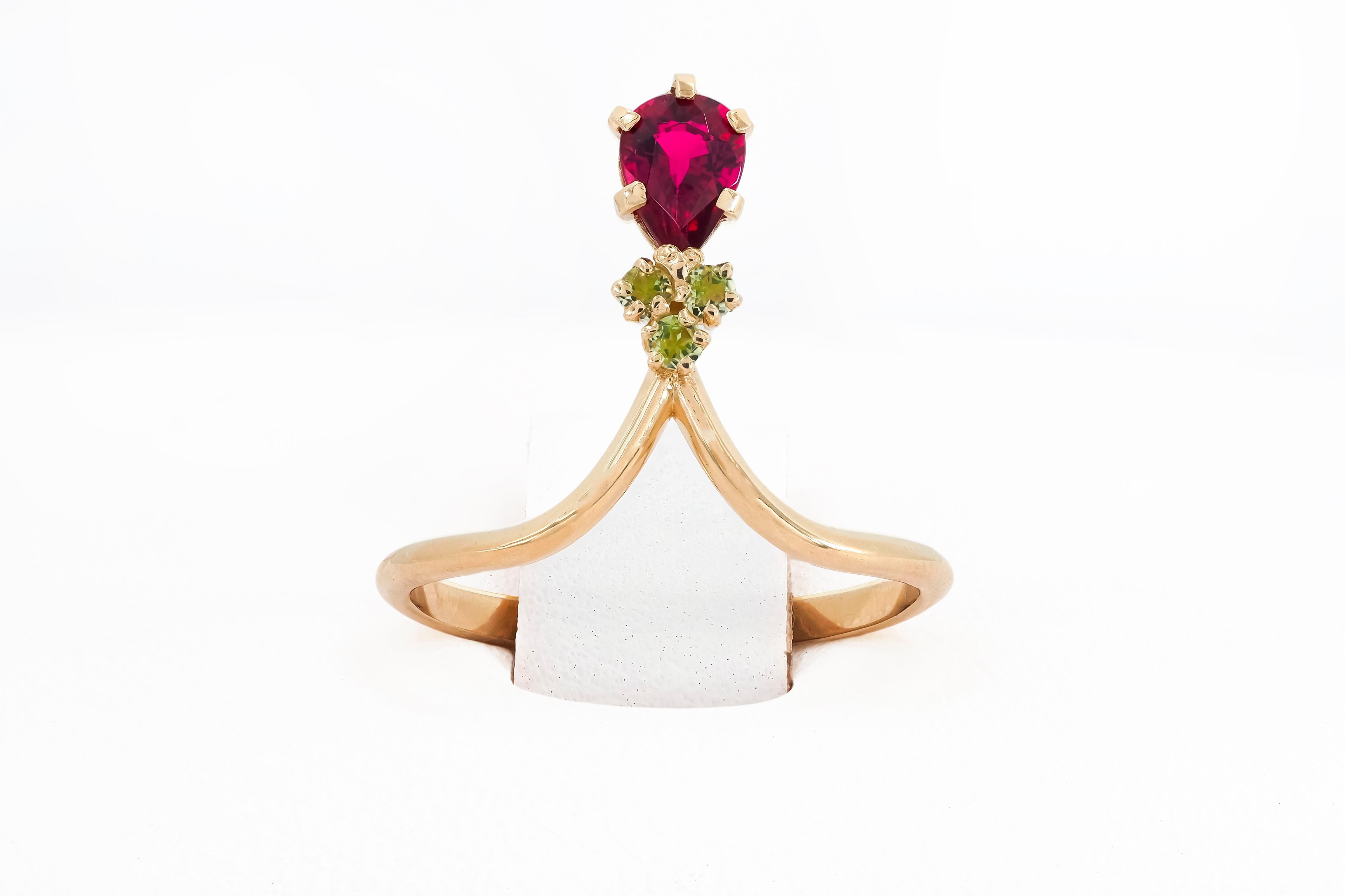 14k gold ring with tourmaline and tsavorites

Metal: 14 k gold
 weight 1.6 gr depends from size

Gemstones (all are tested by proffesional gemmologist)

Tourmaline
Pear cut, 0.8 ct, transparent,  red (rubellite) color. 

Tsavorites (green