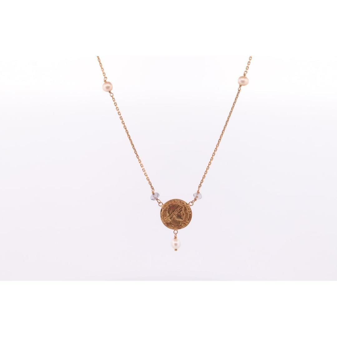 Vintage from the 1980s
Materials: Gold
Gemstone: Pearl
Closure: Spring ring

Chain style: Bead

Beautiful Dainty Necklace.

14k Yellow Gold Roman coin with Pearl and Gem beads on cable chain necklace.

Details:
4.5grams total weight
16in