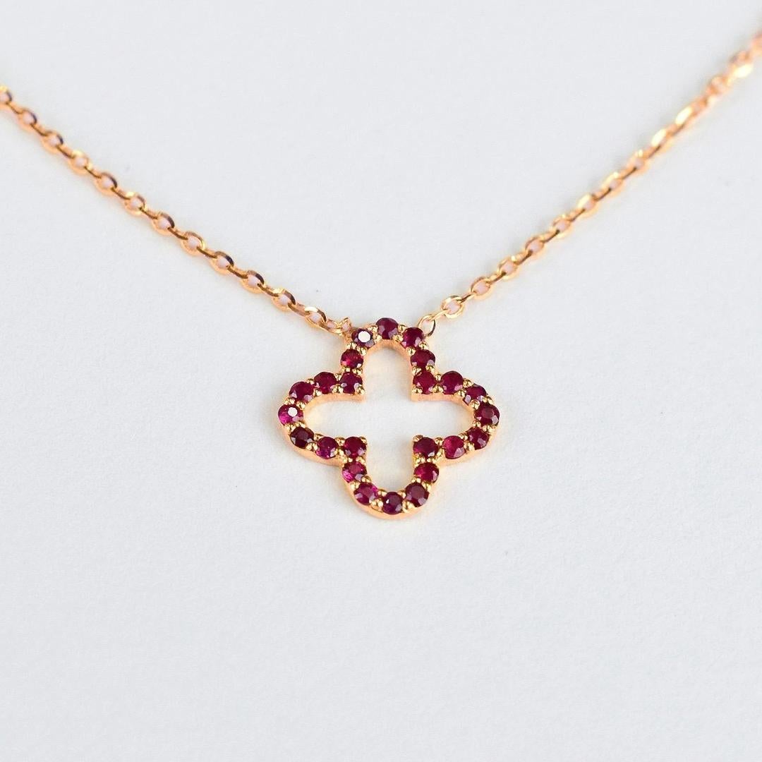 Ruby Clover Necklace is made of 14k solid gold available in three colors, White Gold / Rose Gold / Yellow Gold.

Beautiful little minimalist necklace is adorned with natural AAA quality Ruby Gemstones. Perfect for wearing by itself for a minimal