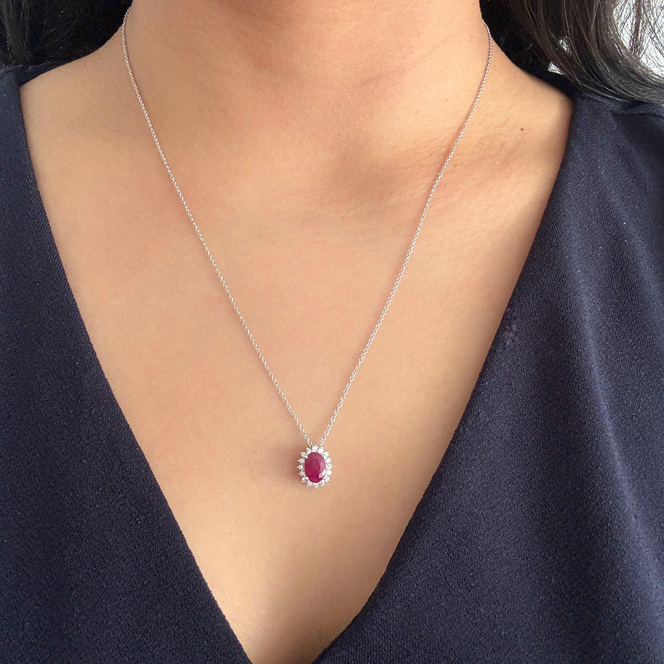 Indulge in luxury with our Ruby and Diamond Pendant Necklace in 14K White Gold. Featuring a stunning 7x5 mm oval ruby, this ruby pendant necklace exudes sophistication and exclusivity. The dazzling halo design with accompanying diamonds adds an