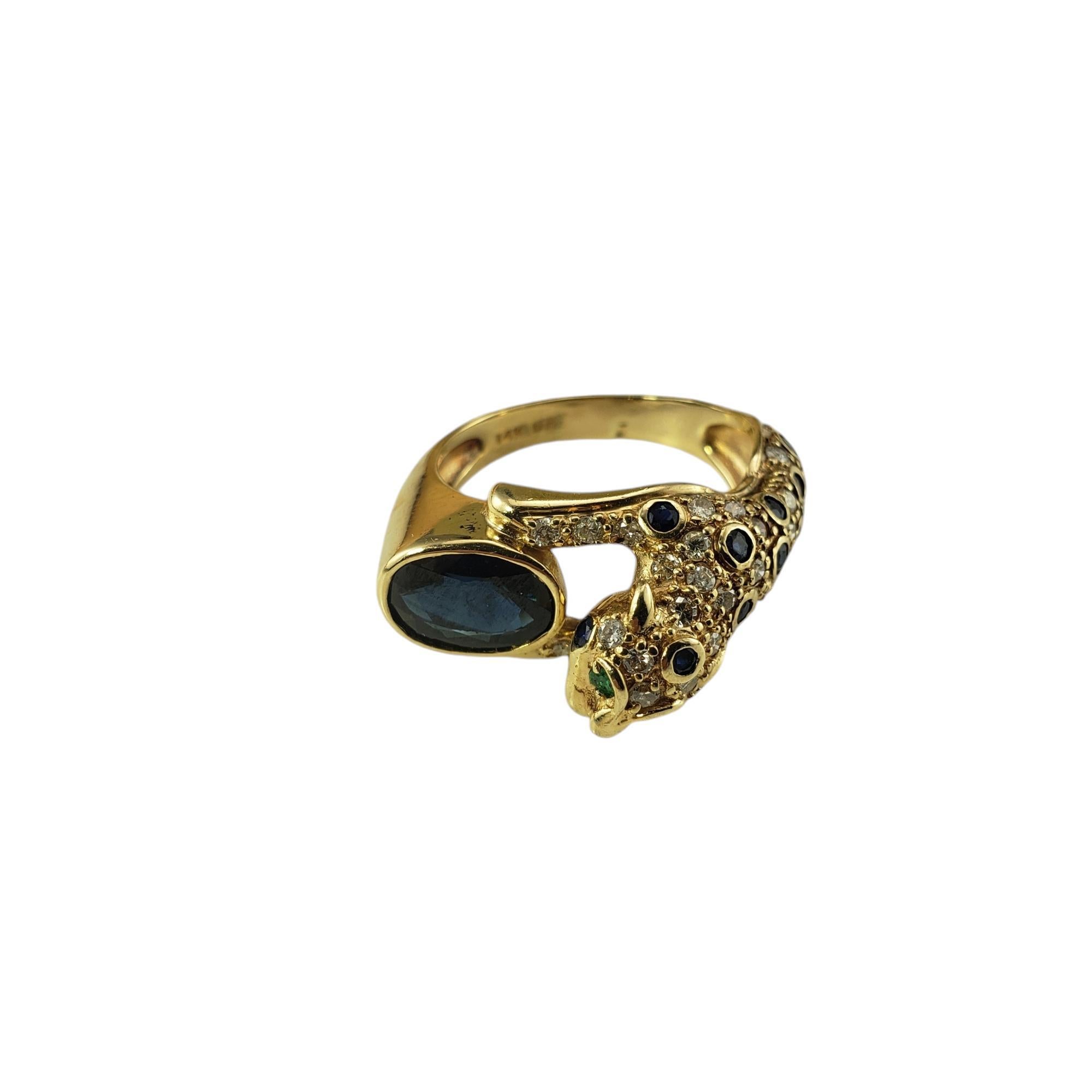 14 Karat Yellow Gold Sapphire, Diamond and Emerald Cheetah Ring Size 7.75 JAGi Certified-

This stunning cheetah ring features one oval blue sapphire (9 mm x 6.7 mm), 31 round brilliant cut diamonds and 15 round blue sapphires set in beautifully