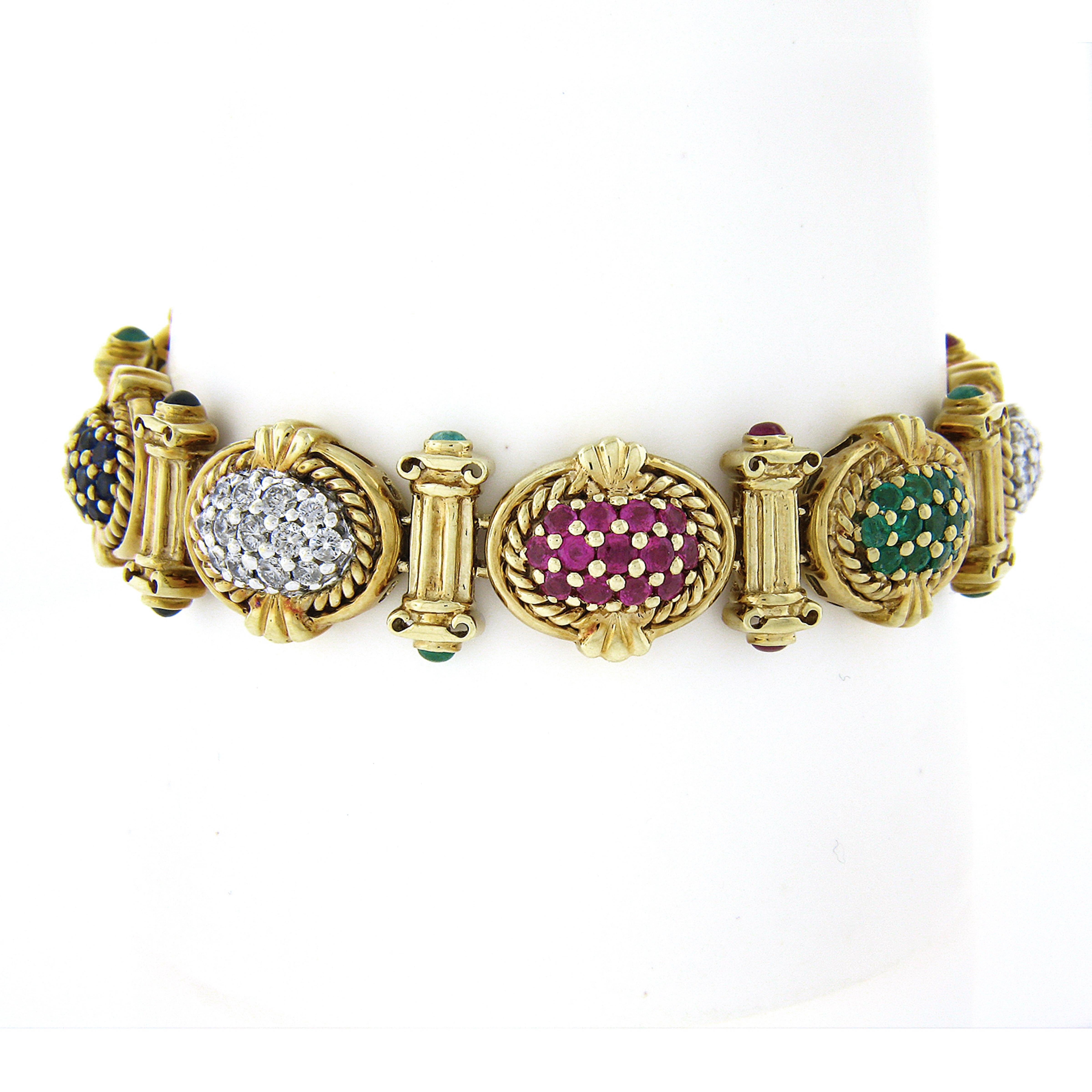 This gorgeous vintage bracelet was crafted in solid 14k yellow gold and features very unique and detailed oval links that are decorated with gold twisted wire and adorned with top quality sapphires, rubies, emeralds and diamonds. The oval links are