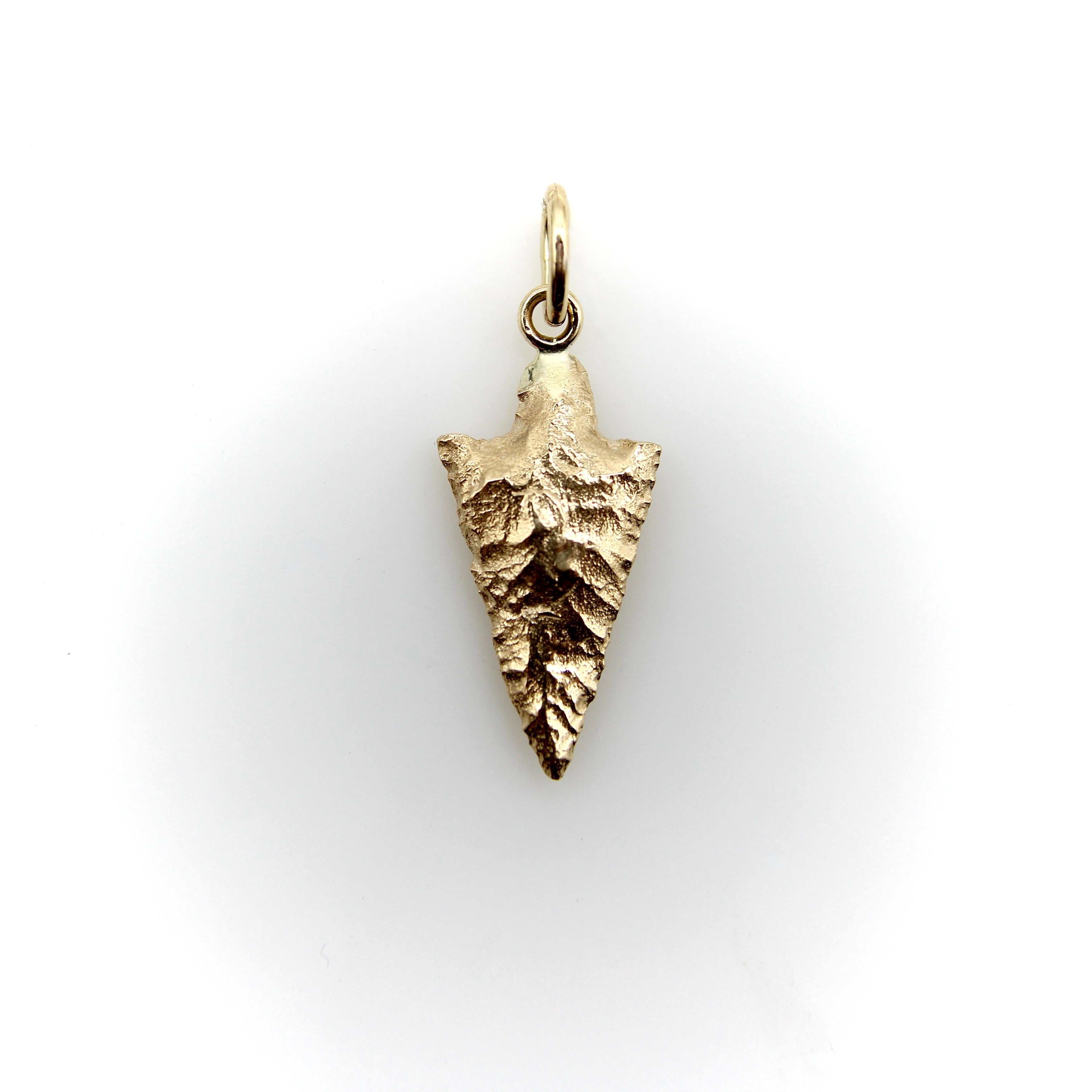 Part of Kirsten’s Corner Signature Collection, this 14k gold arrowhead charm was cast from a mold created using an actual arrowhead. We loved the way the original arrowhead presented itself in gold—the facets of hard rock created beautiful patterns
