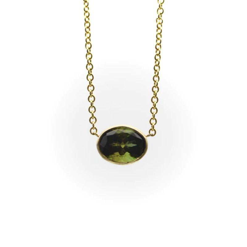 14K Gold Signature Bezel Set Dark Green Tourmaline Necklace

A dark green bezel set tourmaline creates the perfect palate for a simple necklace. Suspended in the middle of a 14k gold chain, the tourmaline hangs just above the collarbone. Part of our