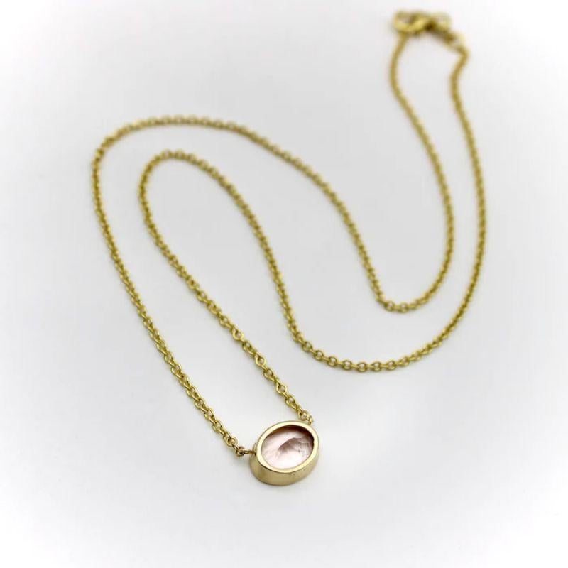 A pale pink bezel set tourmaline creates the perfect palate for a simple necklace. Suspended in the middle of a 14k gold chain, the tourmaline hangs just above the collarbone. Part of our signature collection, this is a one of a kind piece that