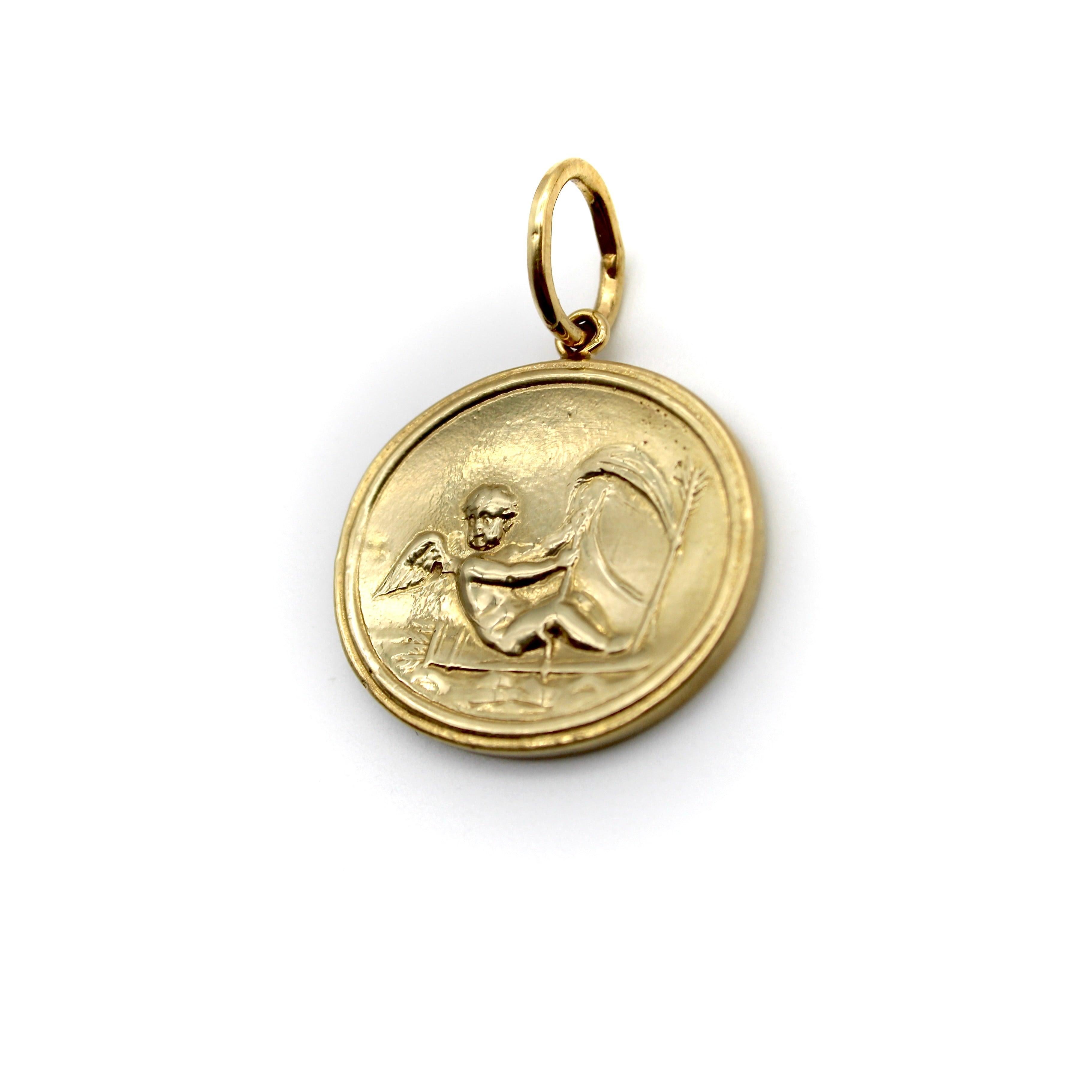 Created as part of our signature collection, this 14k gold intaglio medallion depicts Cupid seated on top of a bow quiver. Cupid, the god of love and attraction, draws his arrow, ready to strike an unsuspecting victim with the power of love. Beneath