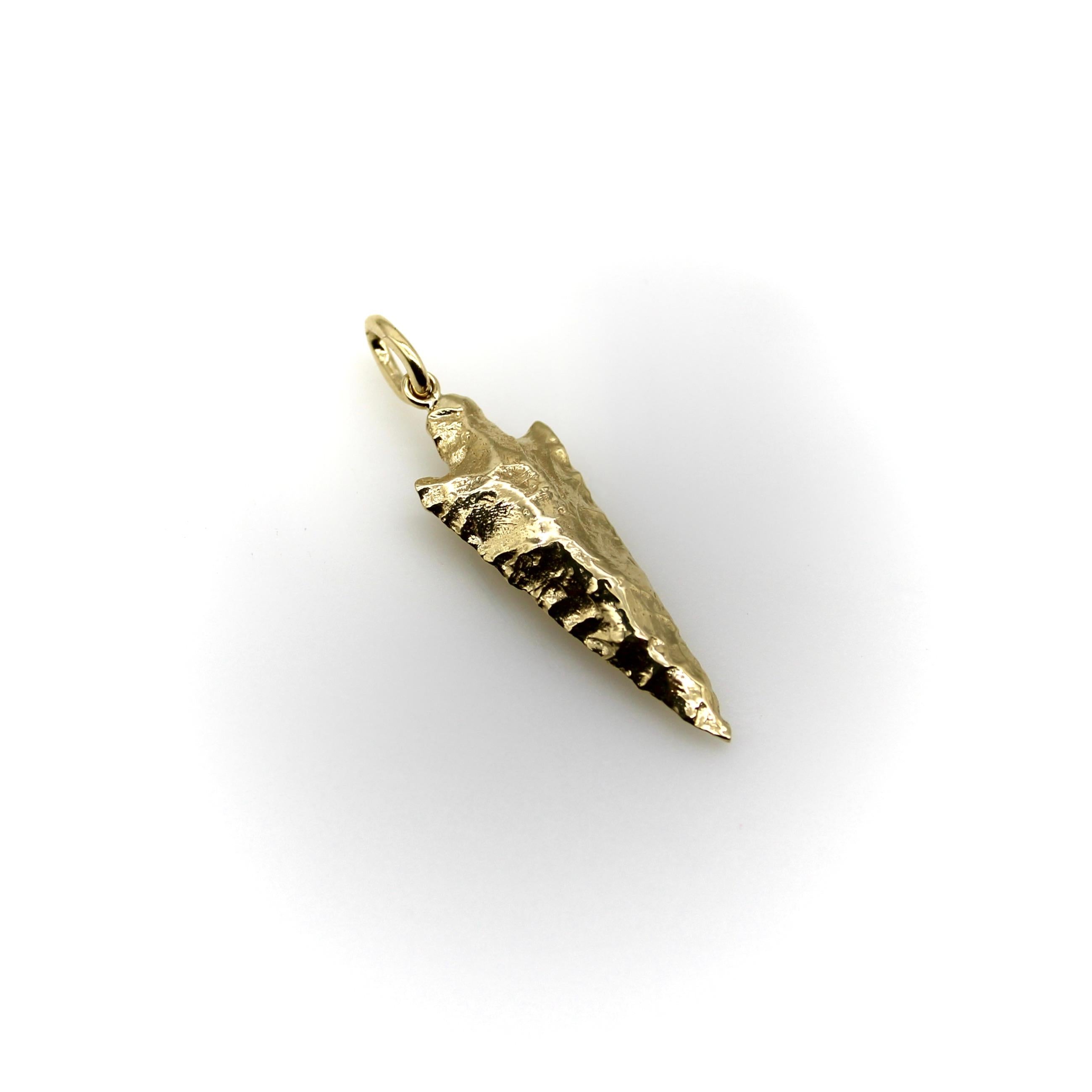 Part of Kirsten’s Corner Signature Collection, this 14k gold elongated arrowhead charm was cast from a mold created using an actual arrowhead. We loved the way the original arrowhead presented itself in gold—the facets of hard rock created beautiful
