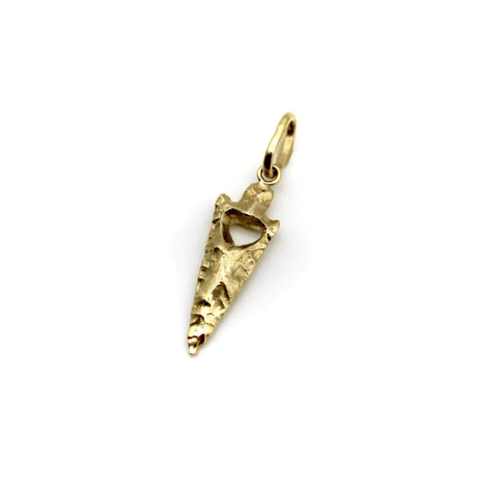 Part of Kirsten’s Corner Signature Collection, this 14k gold arrowhead charm was cast from a mold created using an actual arrowhead. We loved the way the original arrowhead presented itself in gold—the facets of hard rock created beautiful patterns