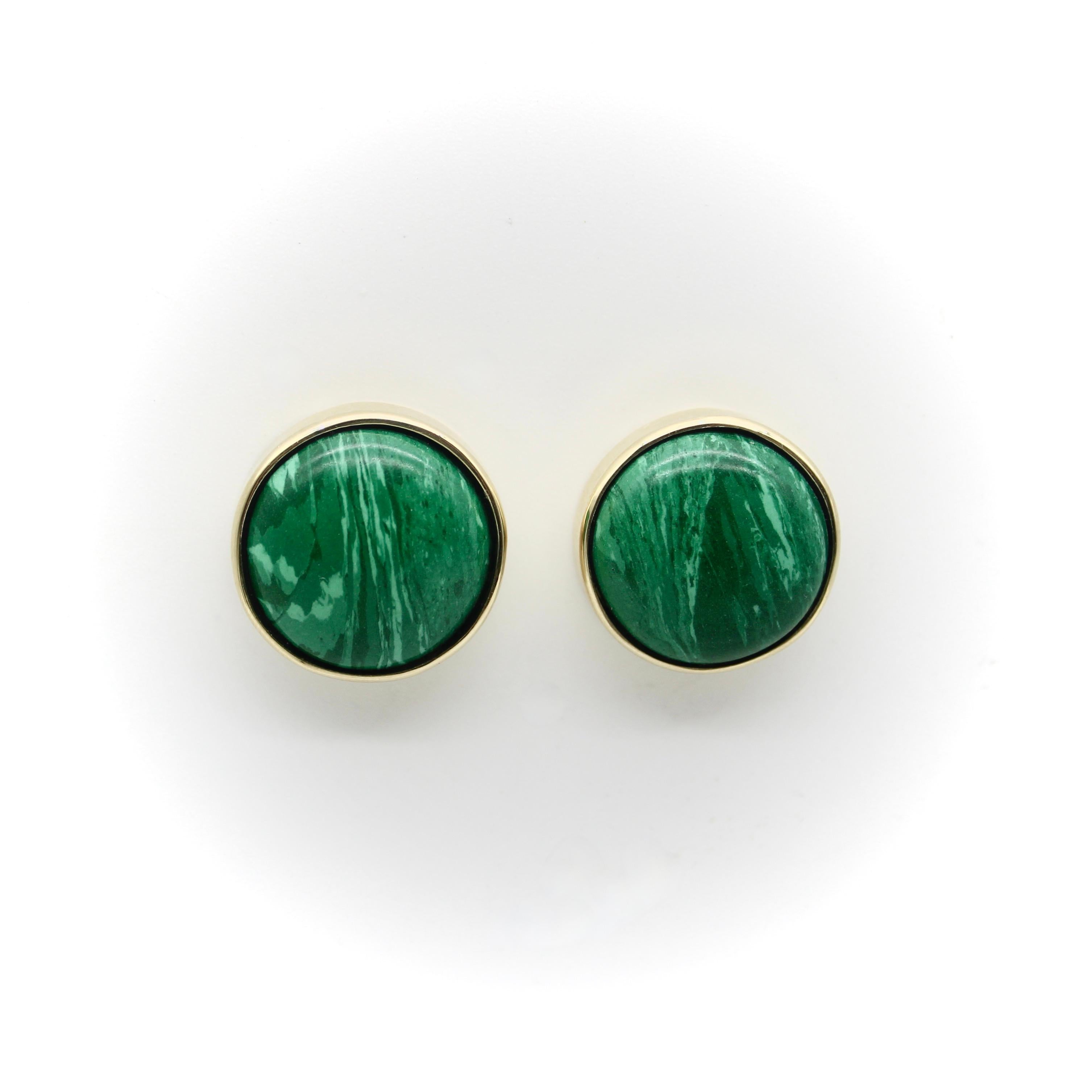 Part of our signature collection, these adorable malachite earrings have a 1950’s mid-century feel to them, reminiscent of buttons or pillbox hats. We choose two stones with similar light and dark green patterning and bezel set them into 14k gold
