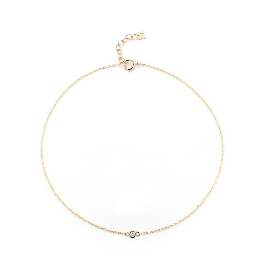 The beautifully simplistic bracelet features a hand set diamond bezel. Perfect for everyday wear. 