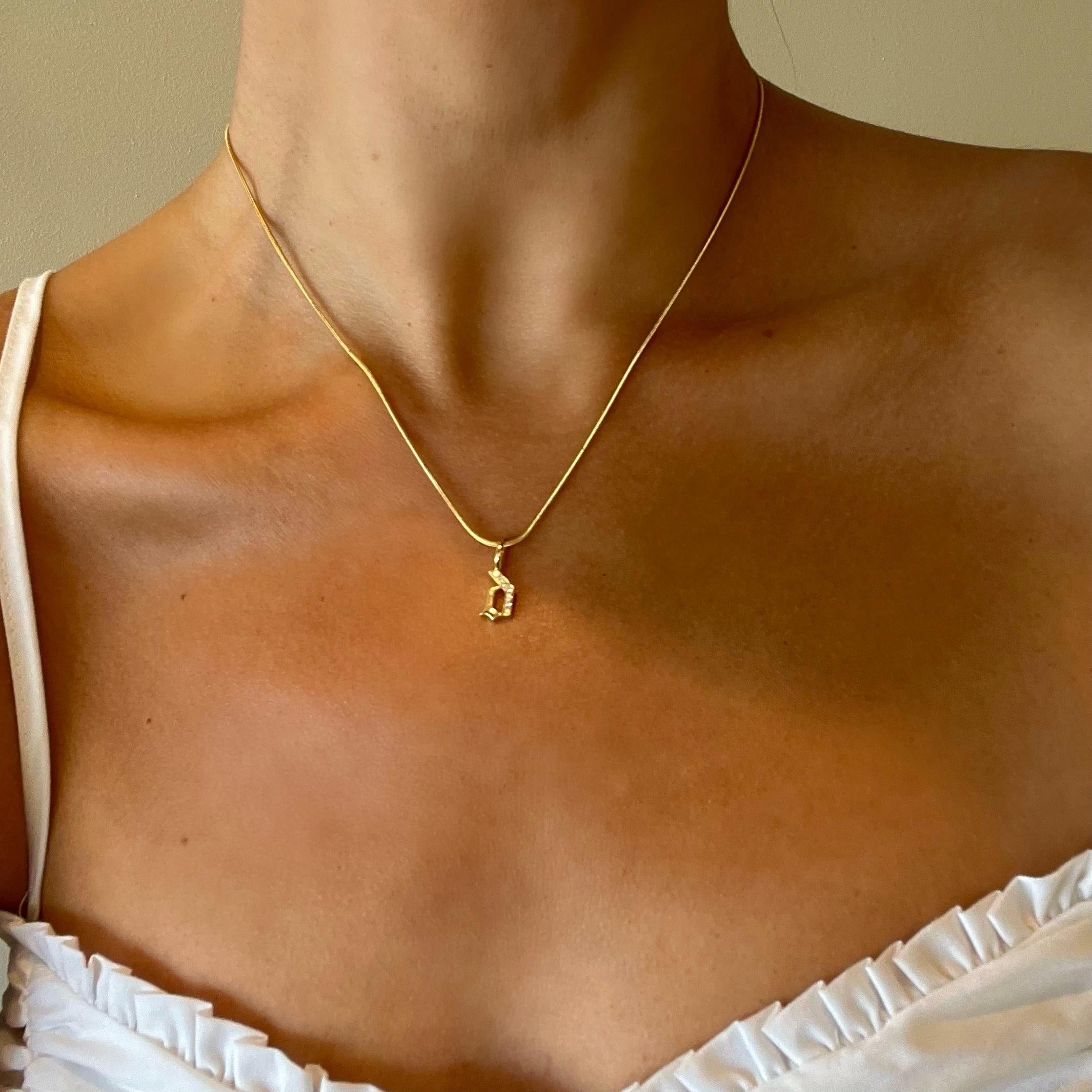LIMITED TIME SUMMER SALE

Crafted with clean lines and understated elegance, this solid 14k gold snake chain features our signature hand-pavé double-sided diamond clasp. Its minimalist design exudes quiet luxury, offering versatile styling