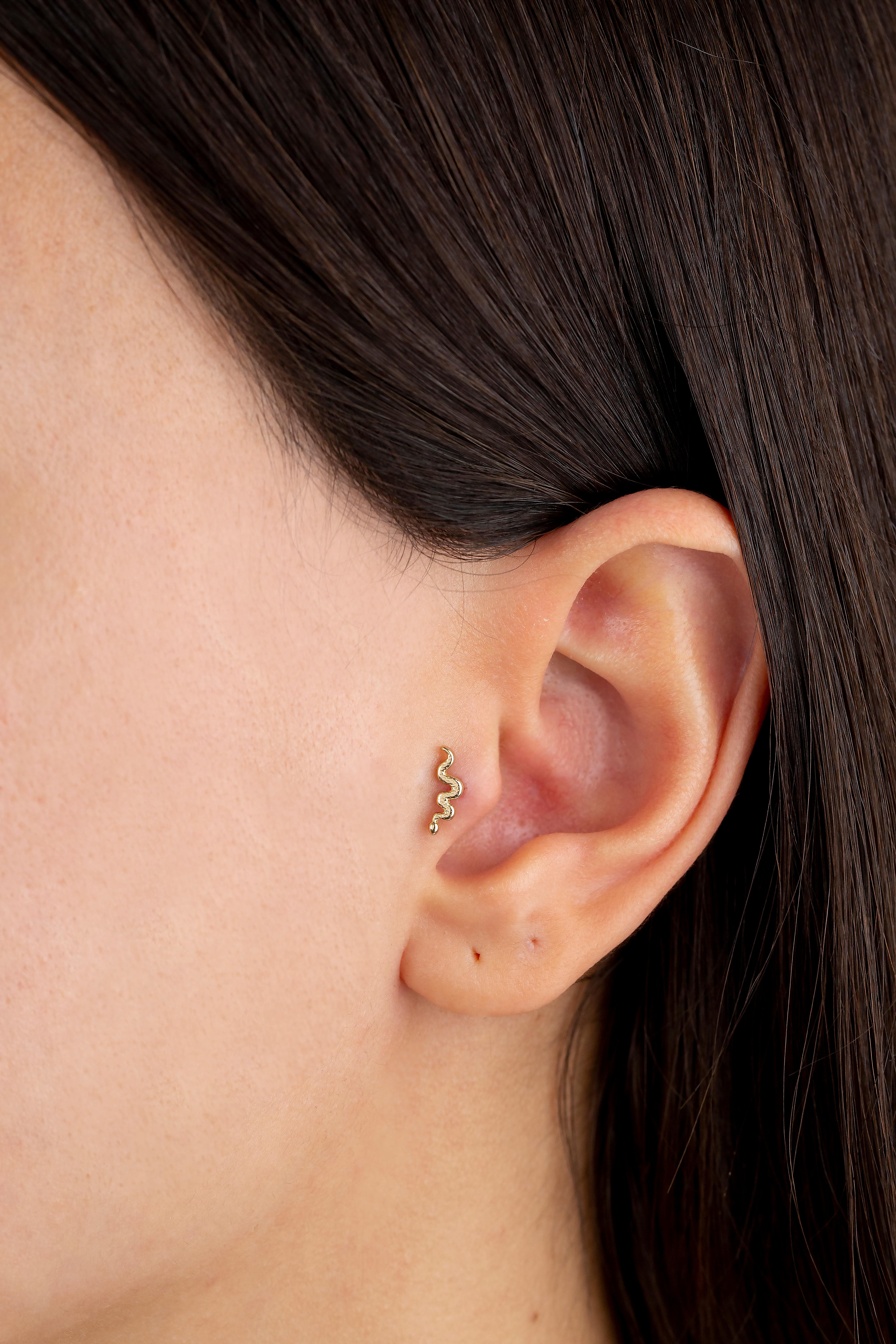 14K Gold Snake Piercing, Gold Stud Snake Earring

You can use the piercing as an earring too! Also this piercing is suitable for tragus, nose, helix, lobe, flat, medusa, monreo, labret and stud.

This piercing was made with quality materials and