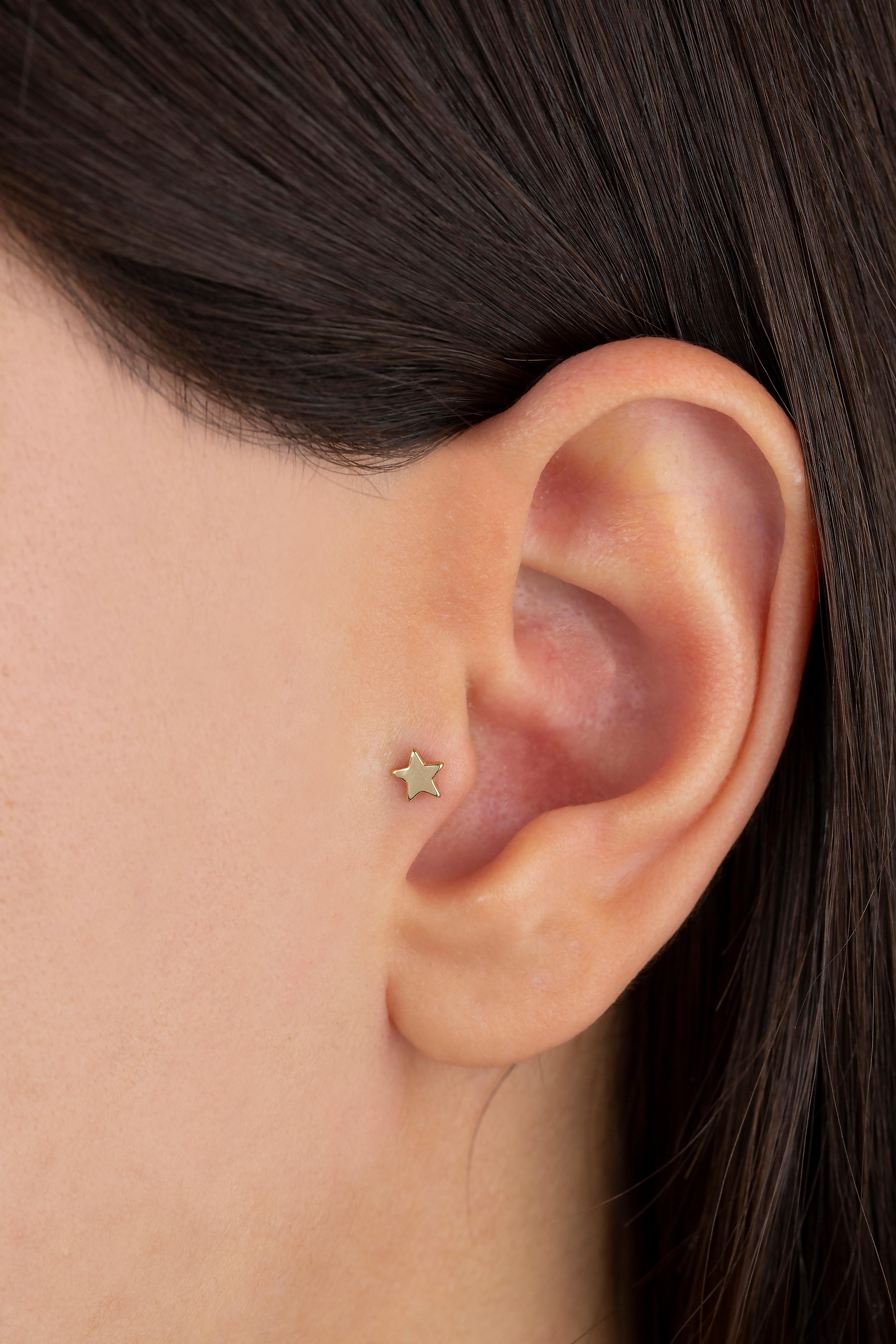 14K Gold Star Piercing, Gold Stud Star Earring

You can use the piercing as an earring too! Also this piercing is suitable for tragus, nose, helix, lobe, flat, medusa, monreo, labret and stud.

This piercing was made with quality materials and