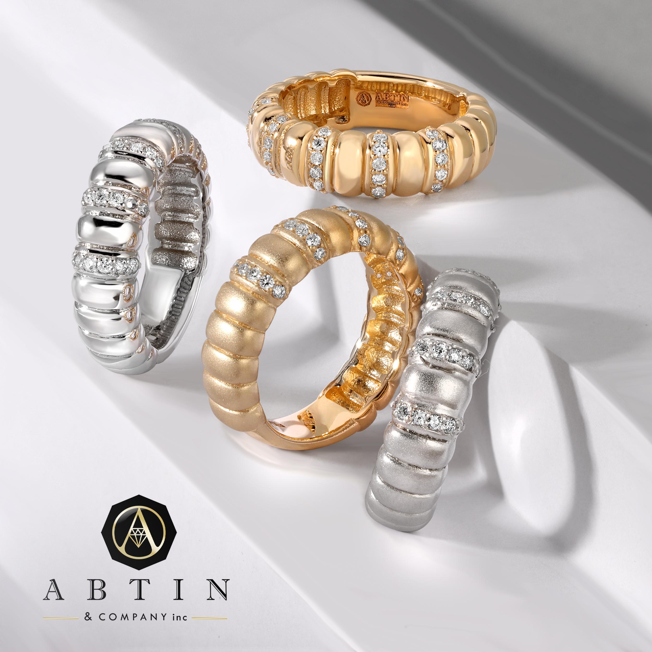 Crafted in 14K gold, this charming ring  showcases 0.28 ct of diamonds in a classic look. It features a ribbed puff design with alternating diamonds and gold bars. Whether worn solo or in conjunction with other rings, this piece is stunning.
Gold