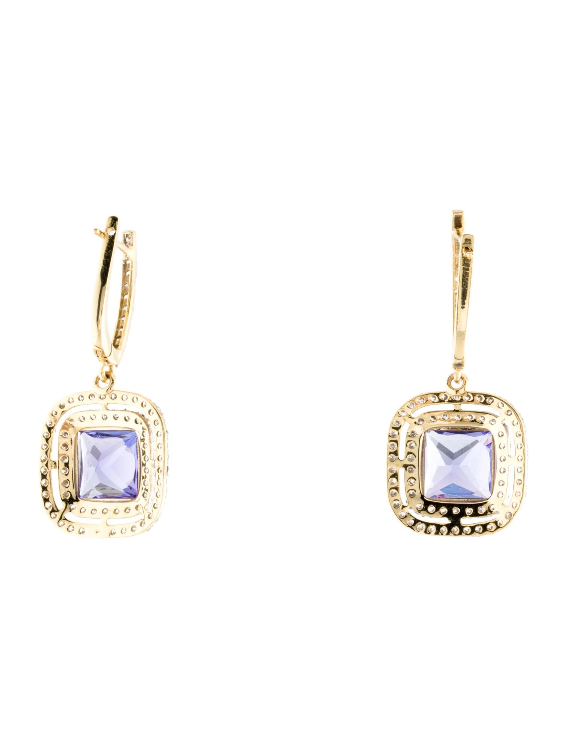 Introducing our exquisite 14K Gold Tanzanite and Diamond Drop Earrings, a luxurious piece of fine jewelry that exudes elegance and style. Crafted with meticulous attention to detail, these high-quality earrings are sure to captivate anyone's