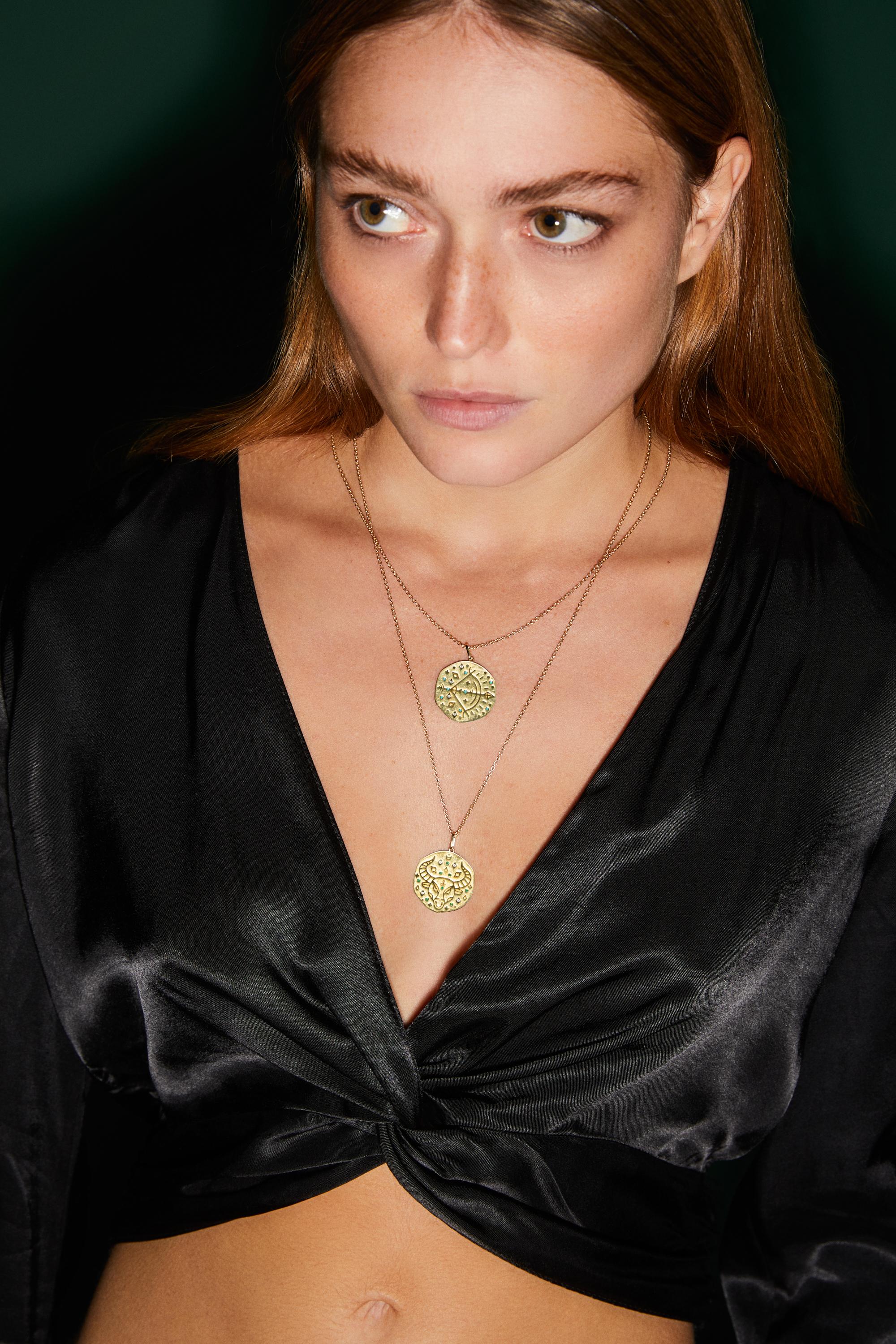 Each Zodiac medallion is encrusted with diamonds and the signs birthstones to enhance the good energy. Comes on a 55 cm chain, this beautiful medallion necklace will be a classic addition to your jewelry box. 