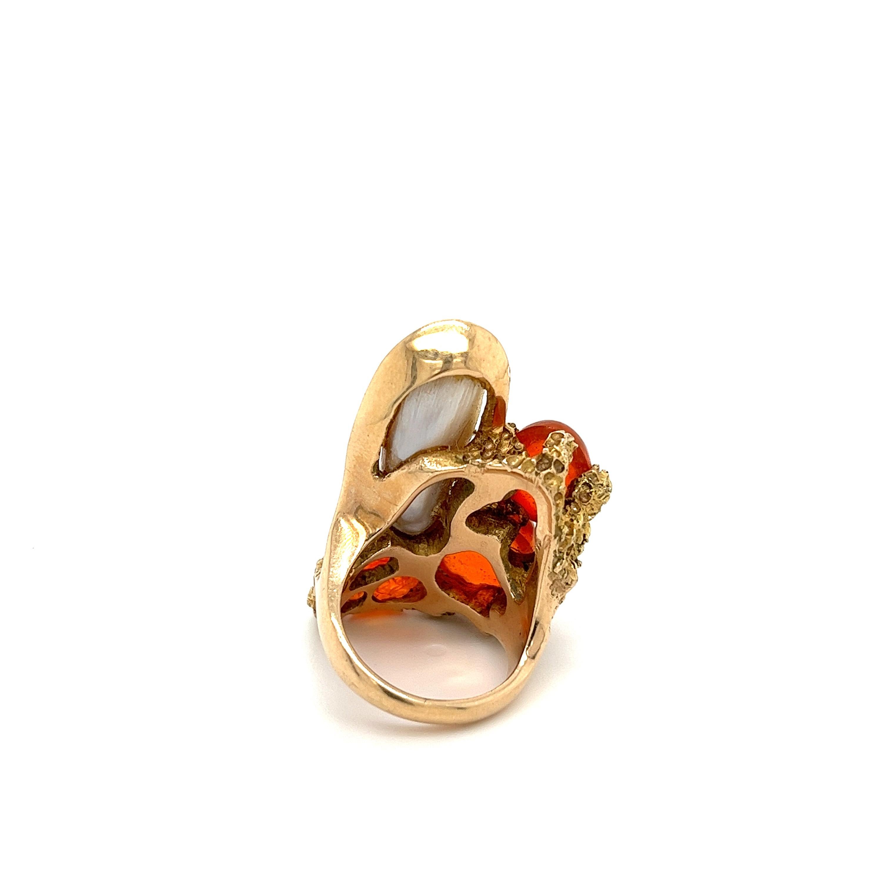 Magnificence in opals, this ring boasts 3 fiery orange tone cabochon cut Mexican opals and a lavender tone mother of pearl. A stunning masterpiece ring with a deep sea coral reef motif. 

Details: 
✔ Metal: 14K 
✔ Weight: 21.8 grams 
✔ Face Size: